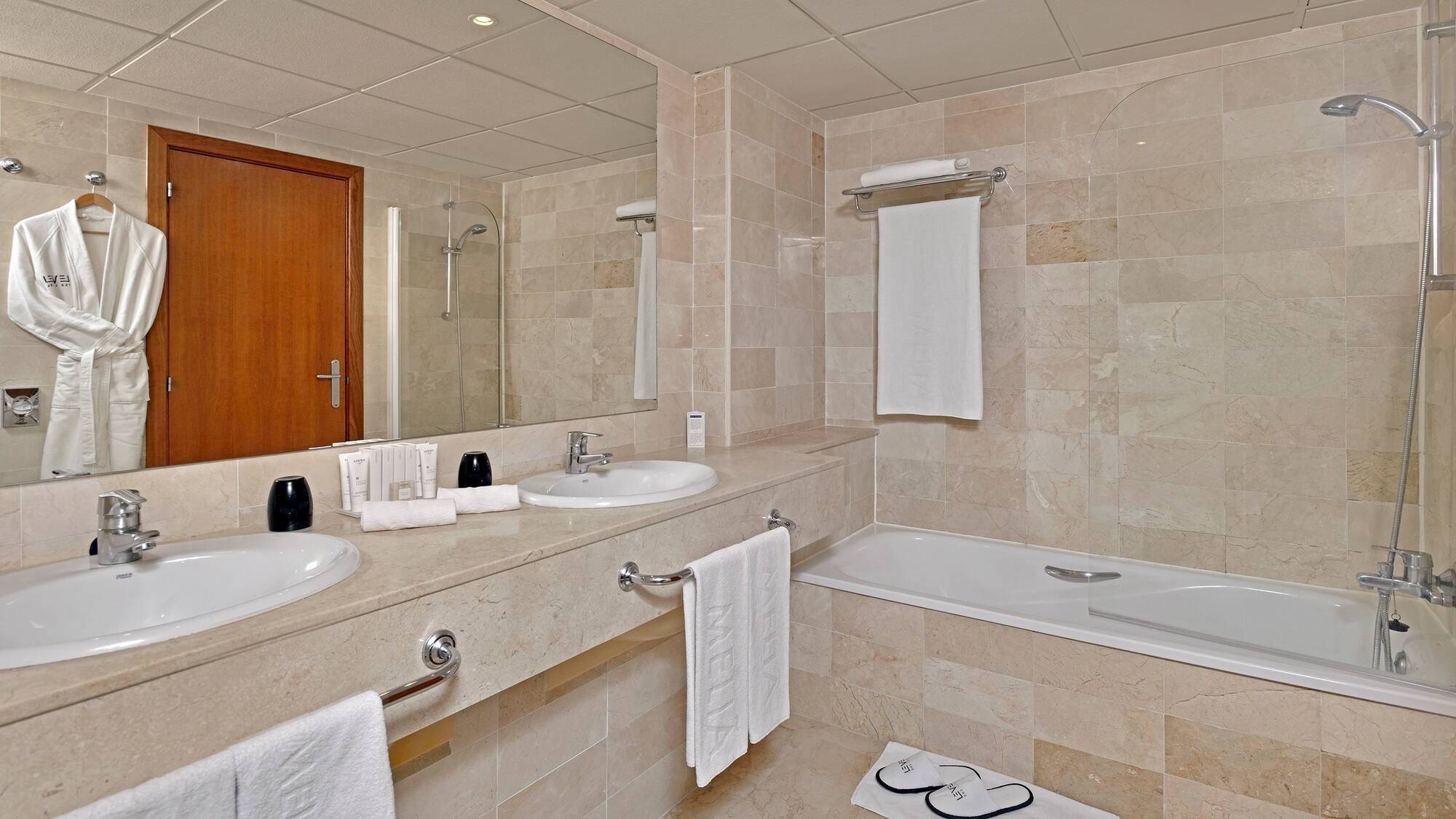 a bathroom with a bathtub and sink