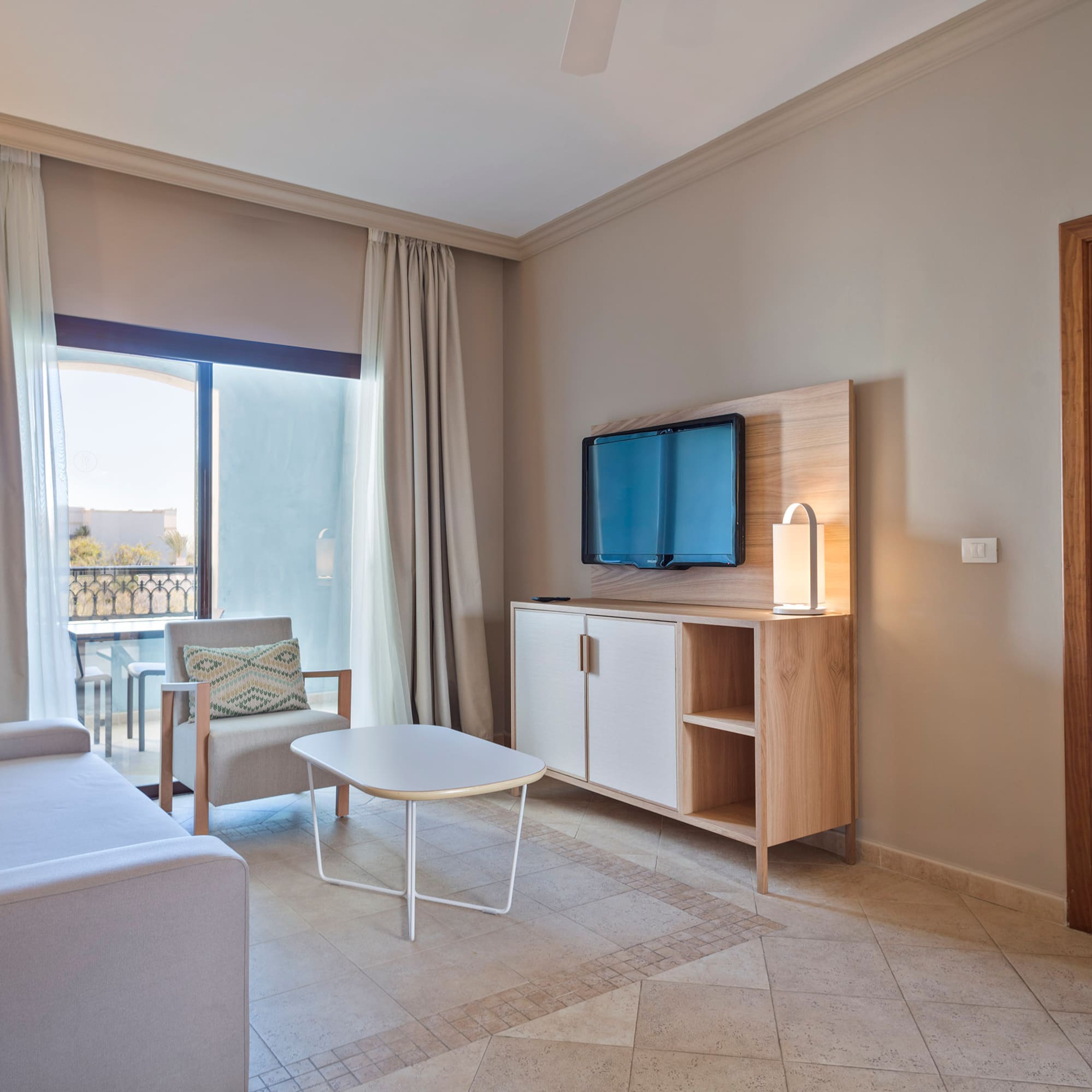 a living room with a television and a table