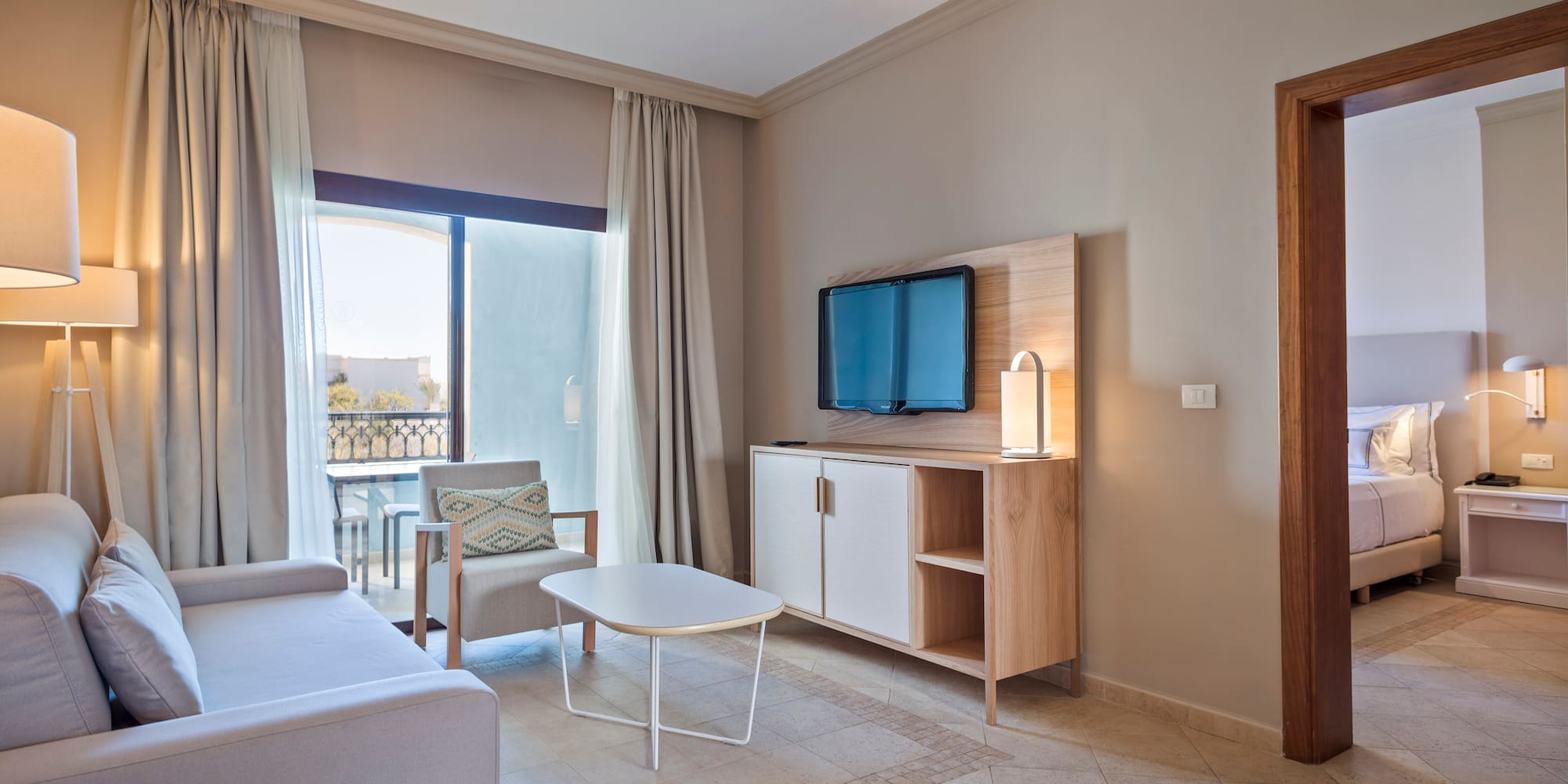 a living room with a television and a table