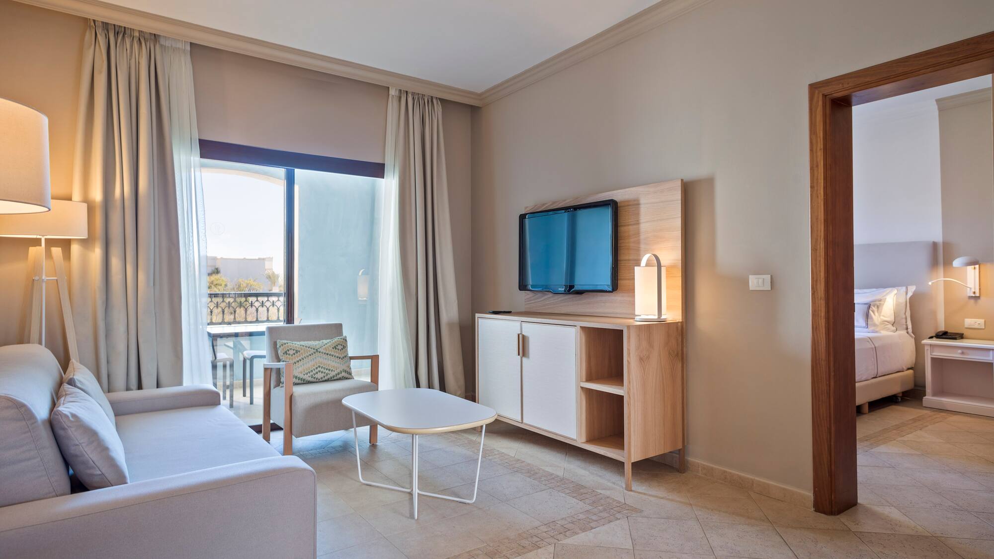 a living room with a television and a table