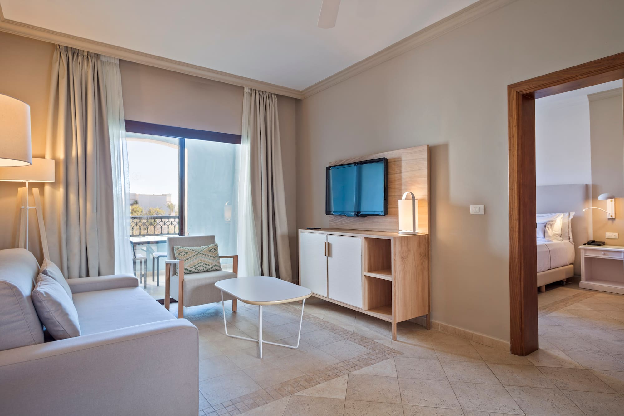 a living room with a television and a table