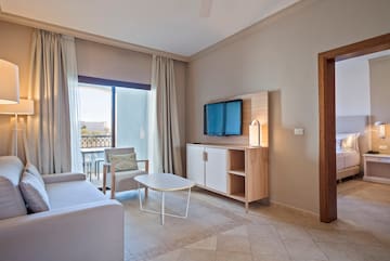 a living room with a television and a table