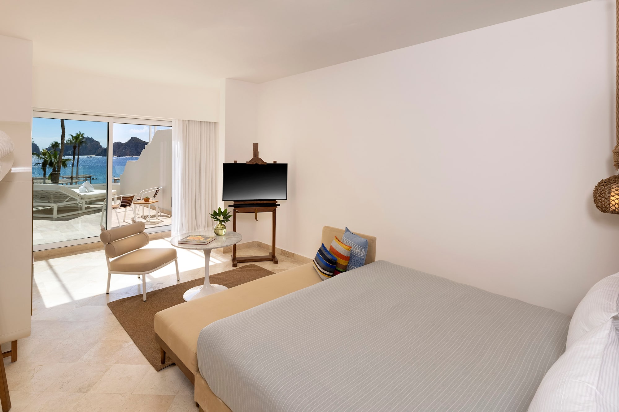 a bedroom with a bed and a television