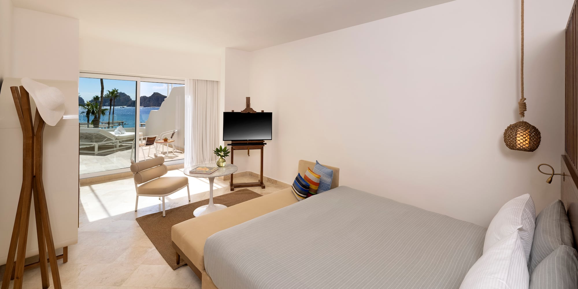 a bedroom with a bed and a television