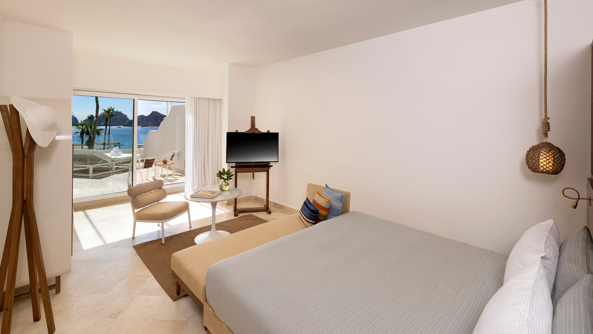 a bedroom with a bed and a television