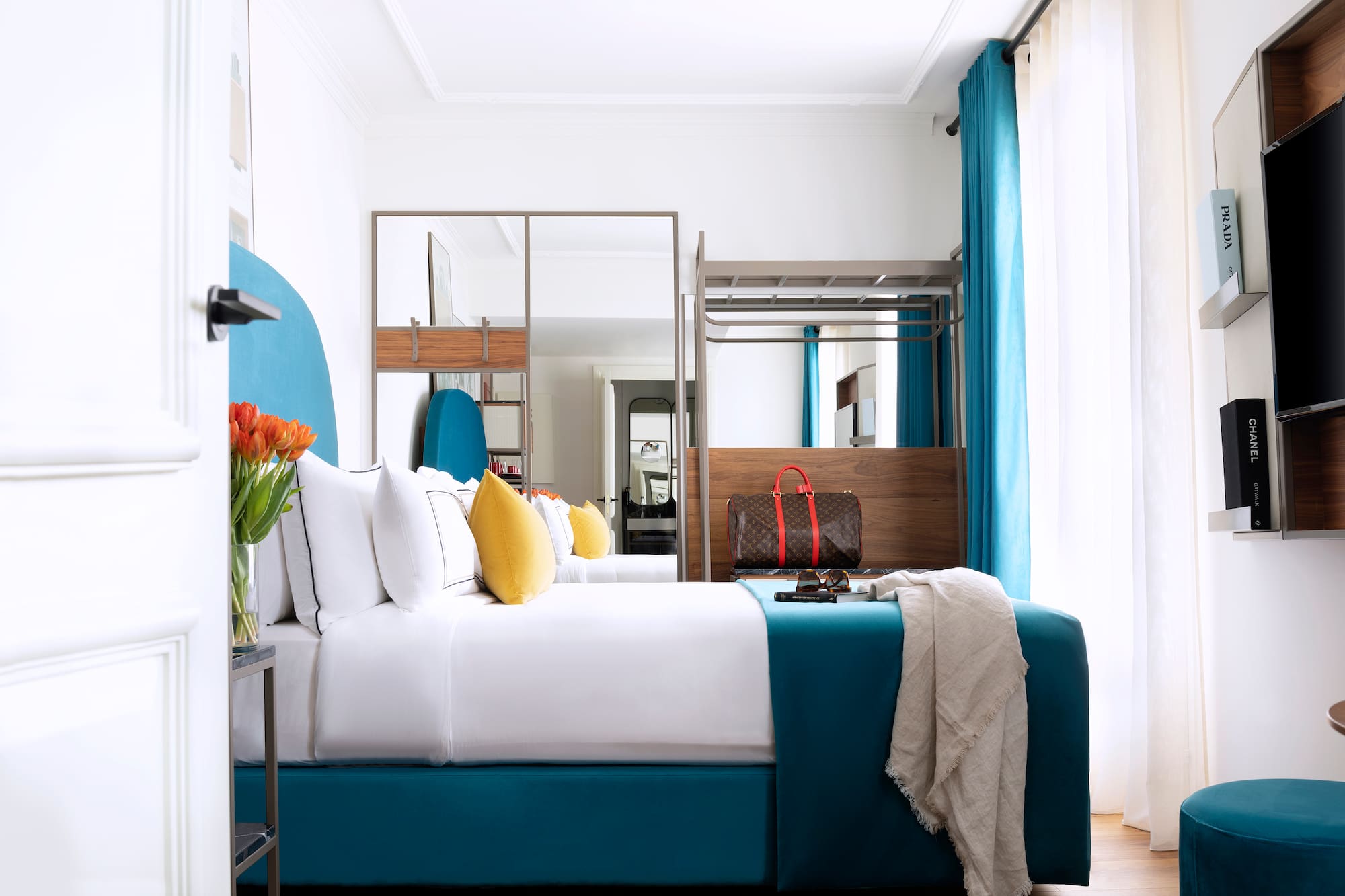 a room with a bed and a mirror