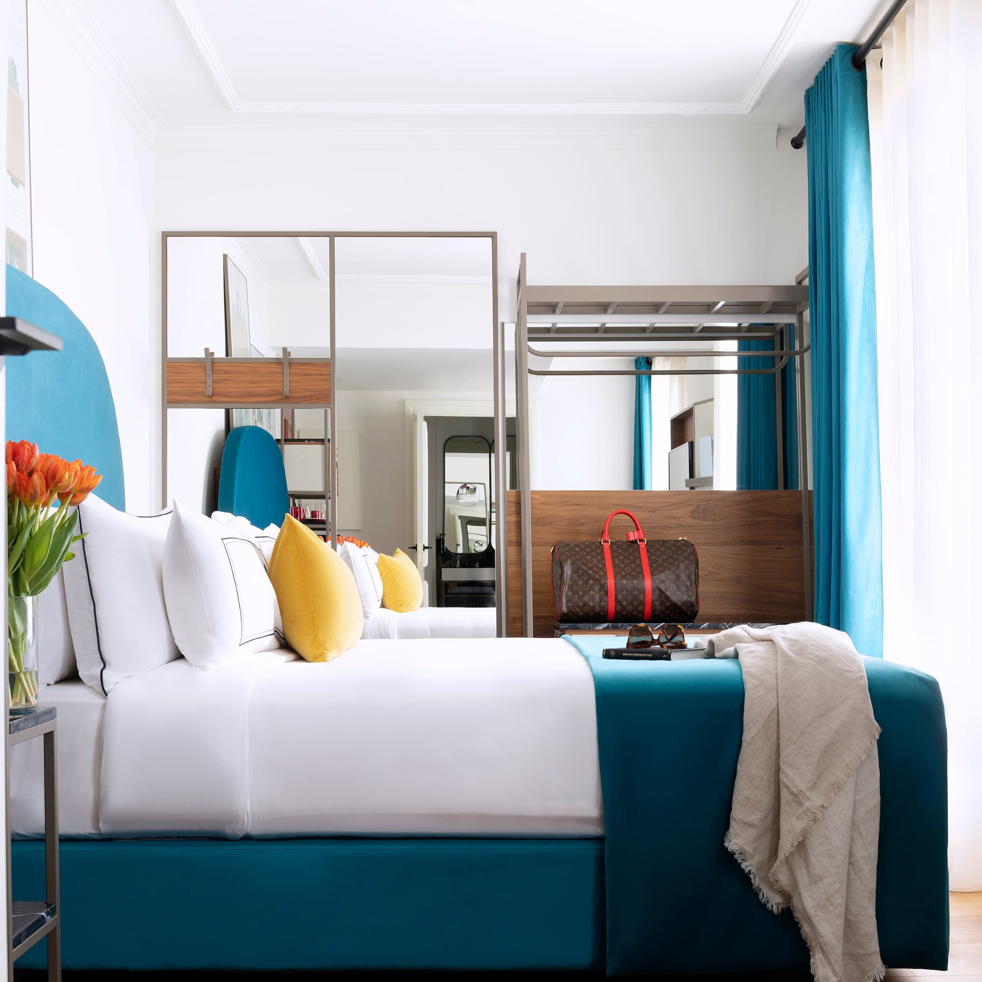 a room with a bed and a mirror