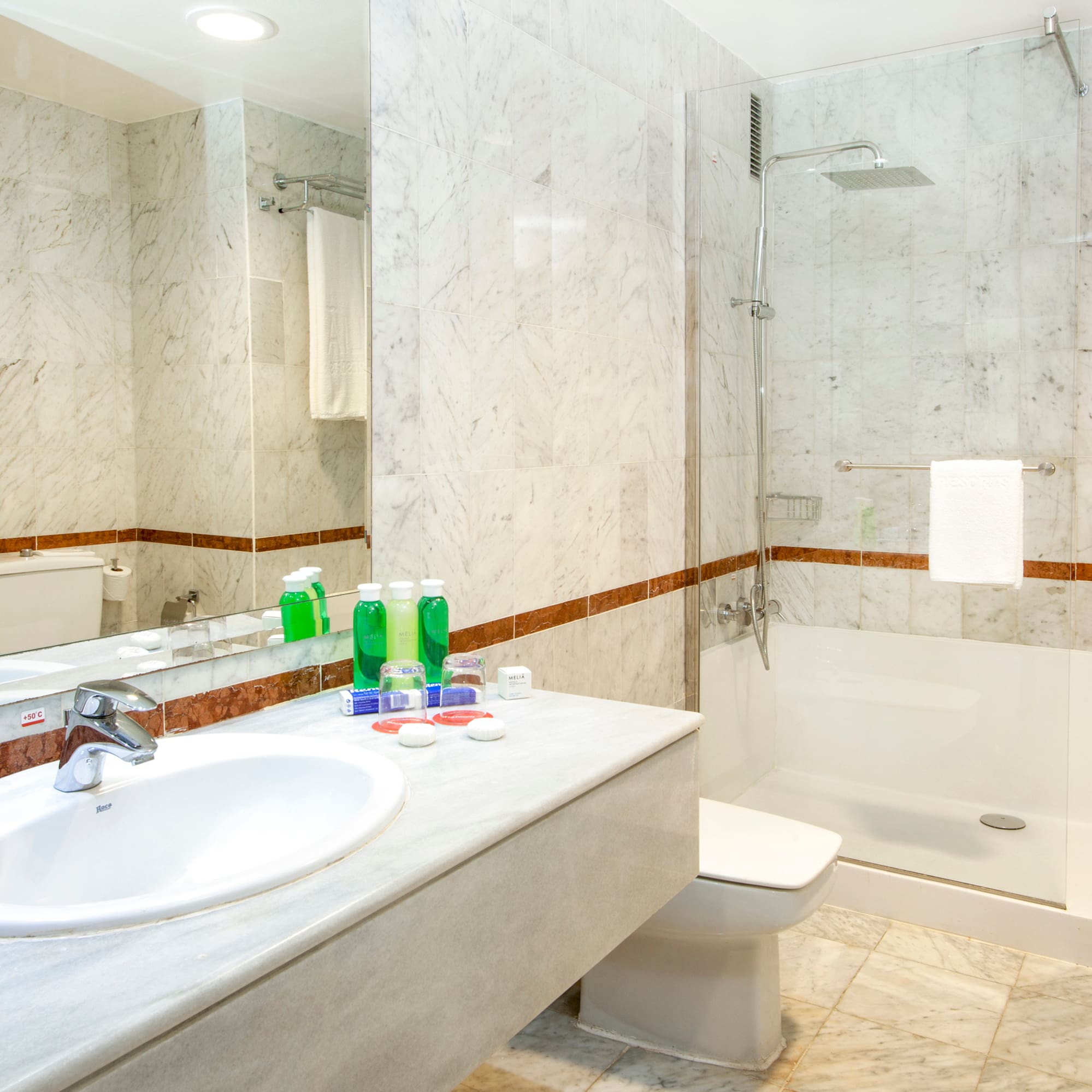a bathroom with a sink and shower