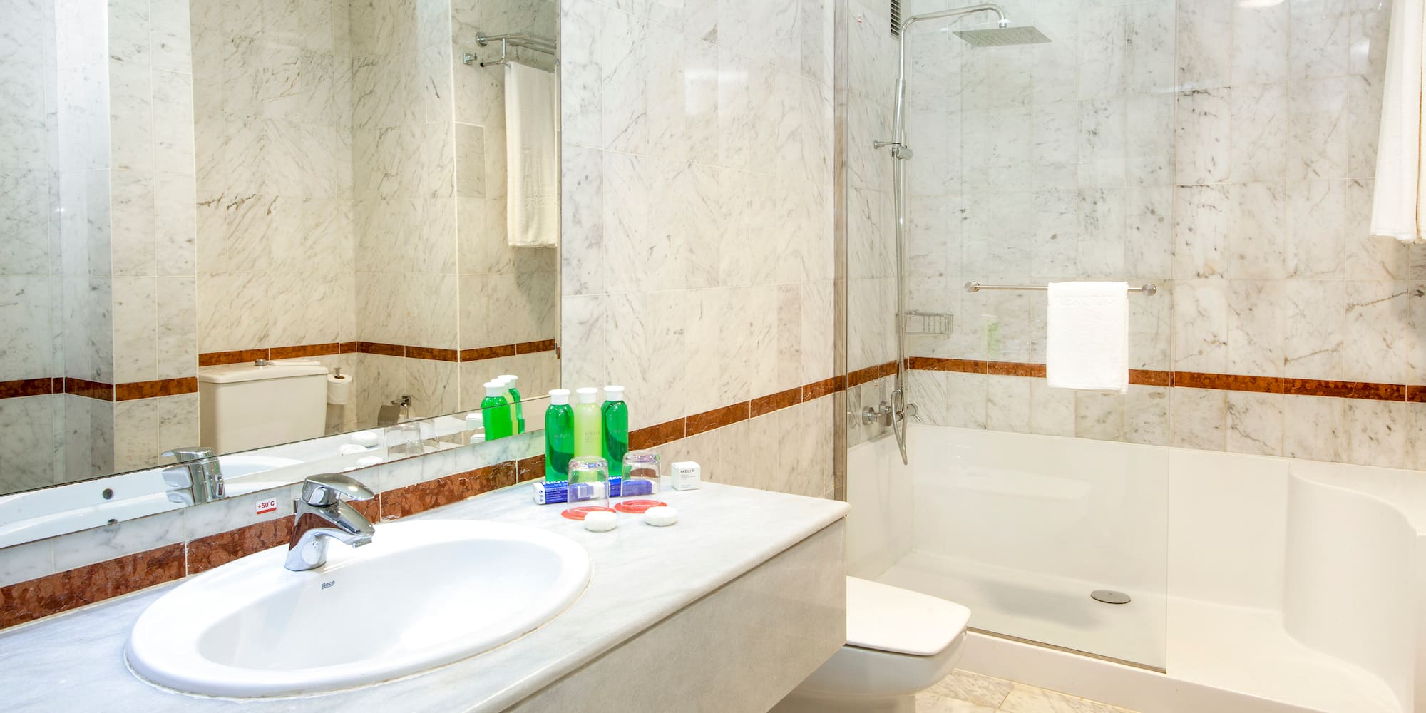 a bathroom with a sink and shower