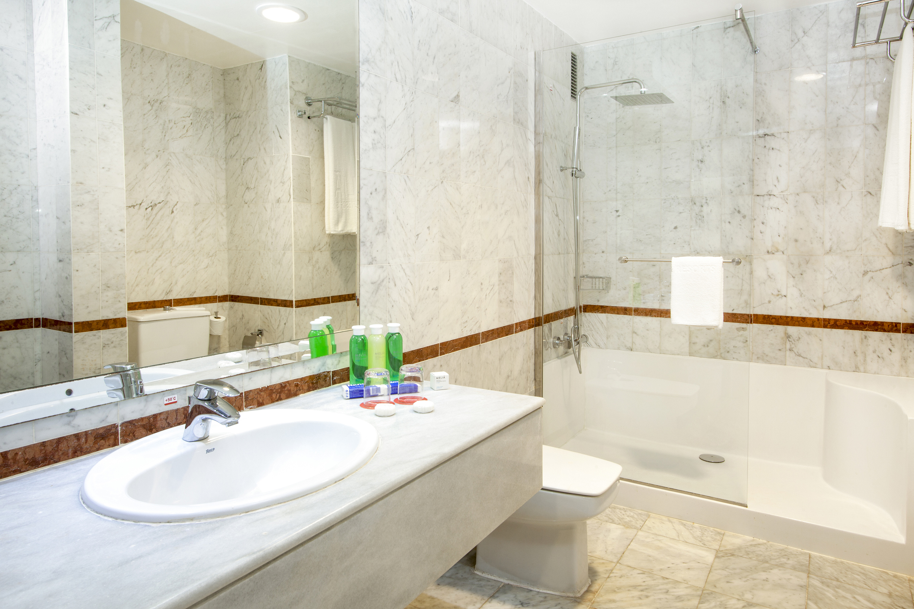 a bathroom with a sink and shower