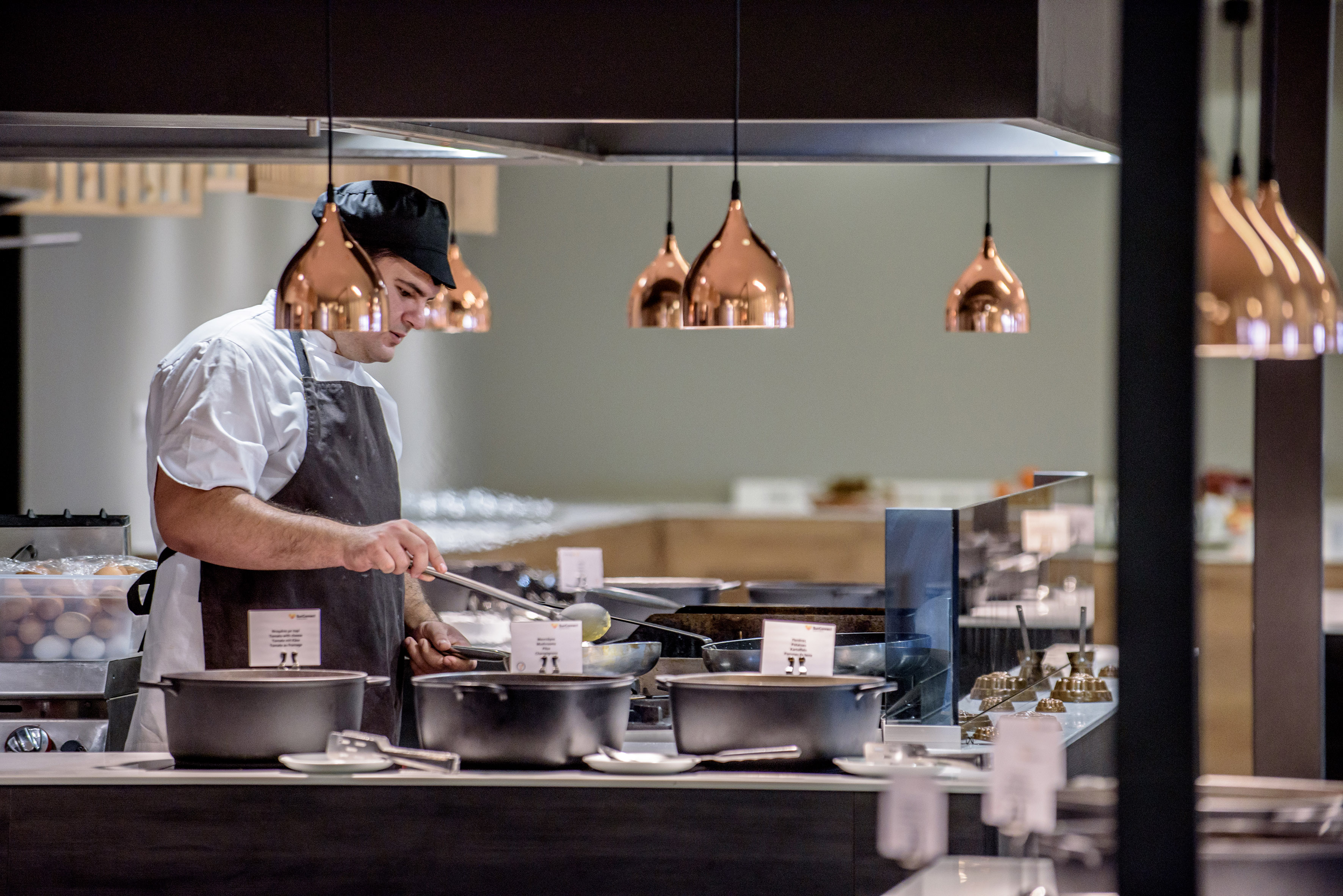 a man in a chef's hat cooking in a kitchen