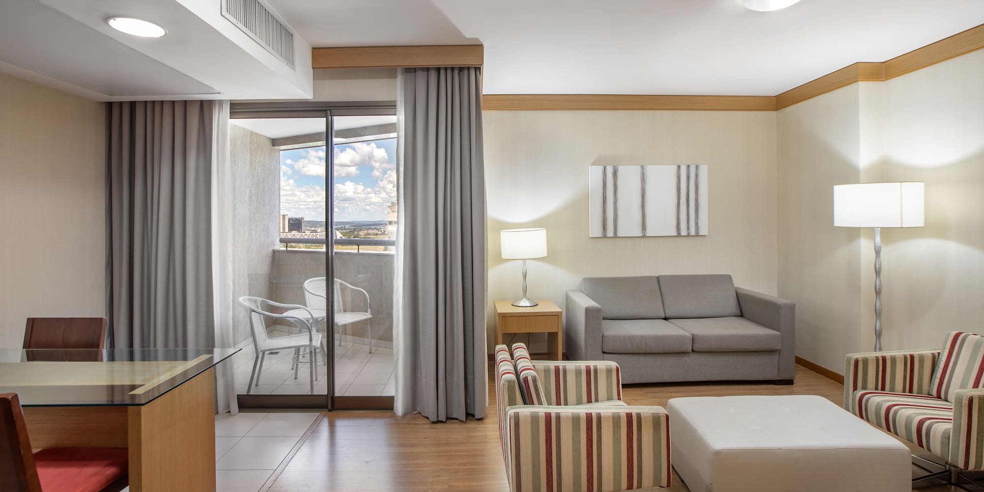 a room with a couch and a glass door