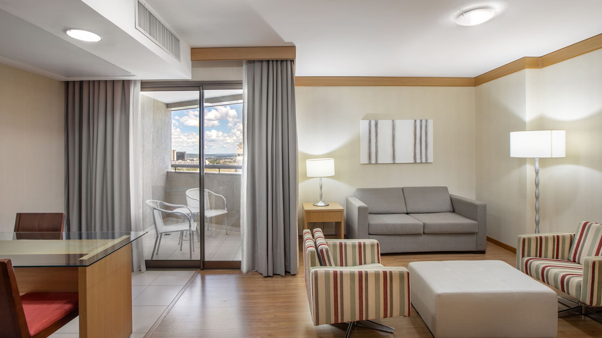 a room with a couch and a glass door