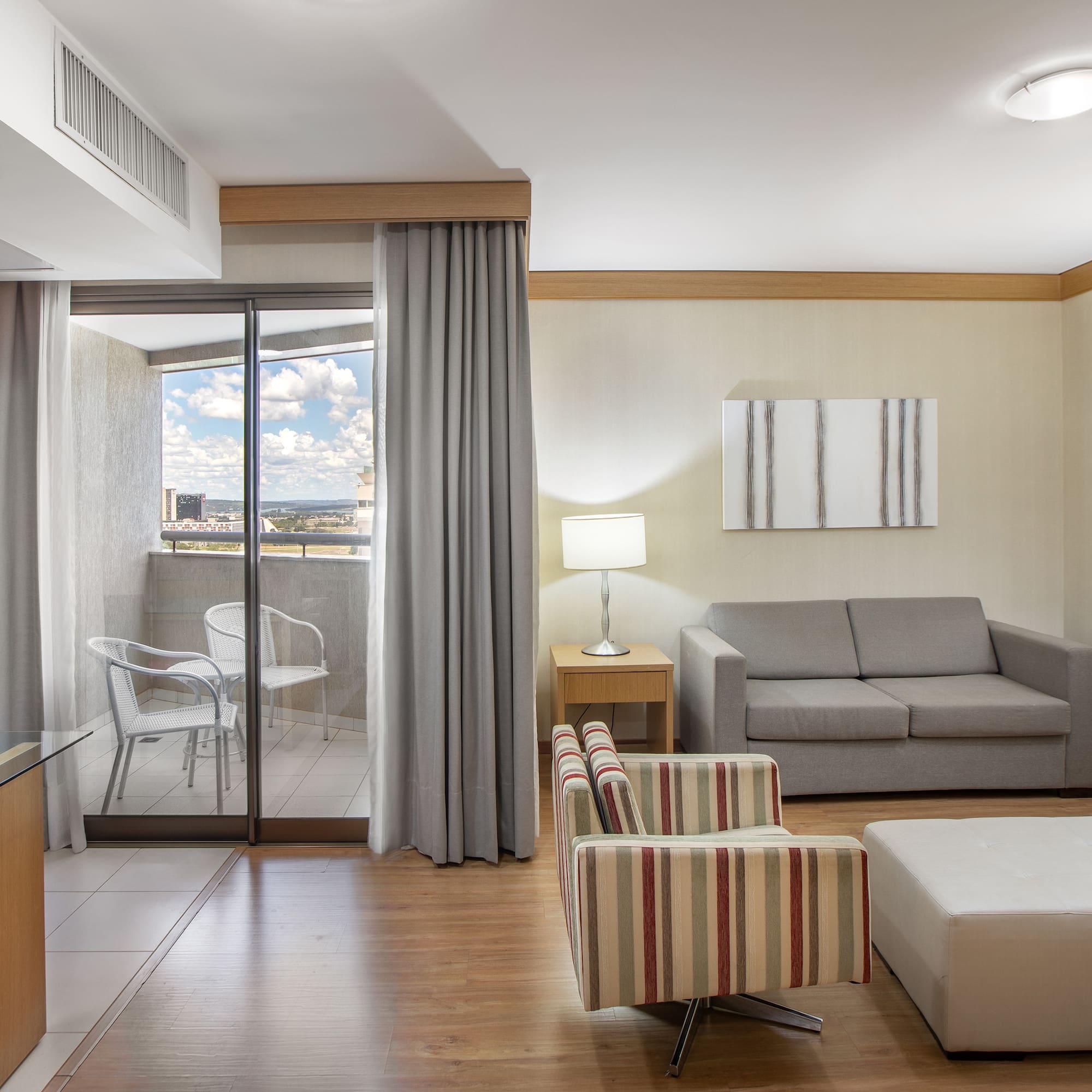 a room with a couch and a glass door