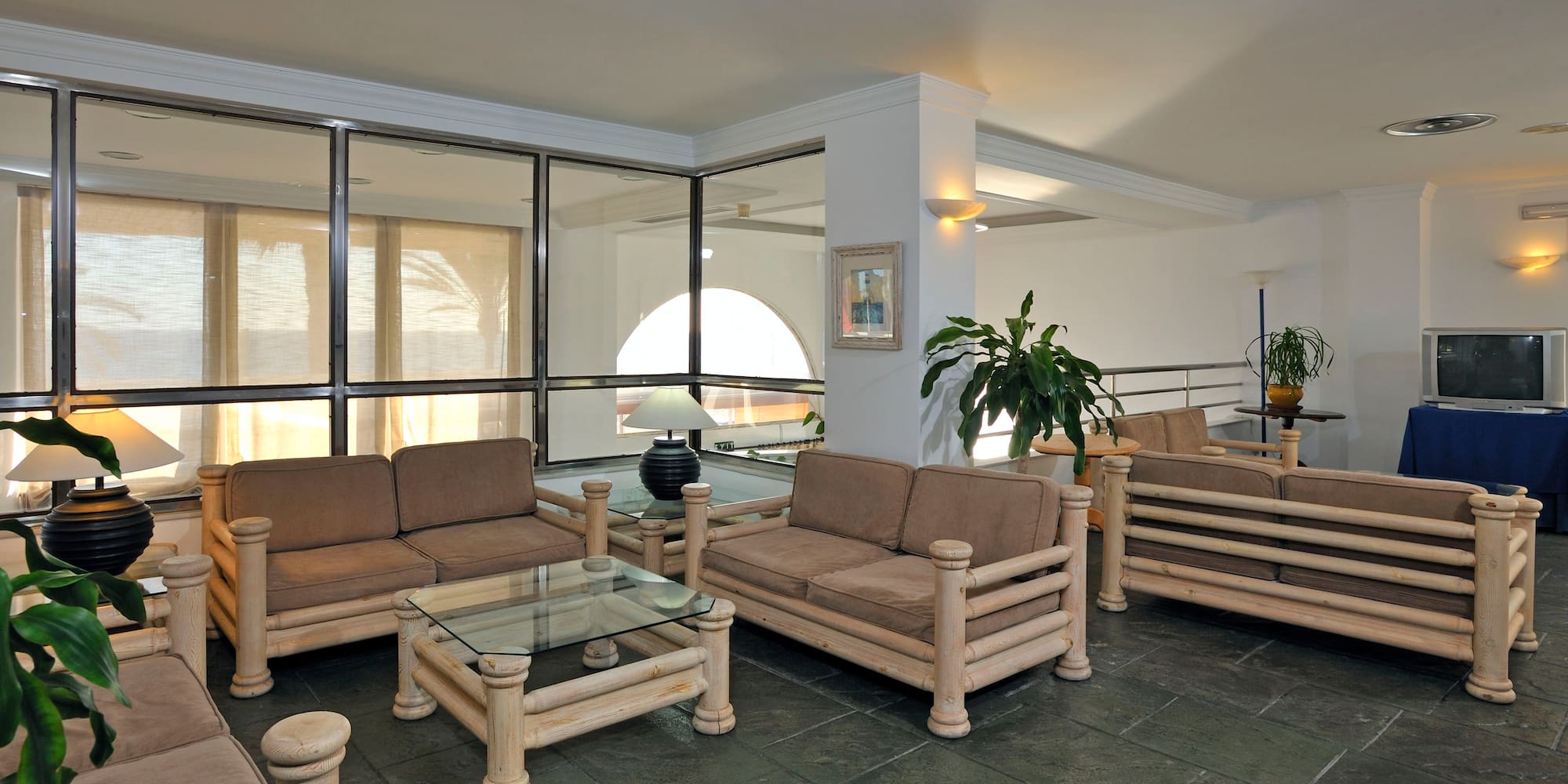 a room with couches and tables