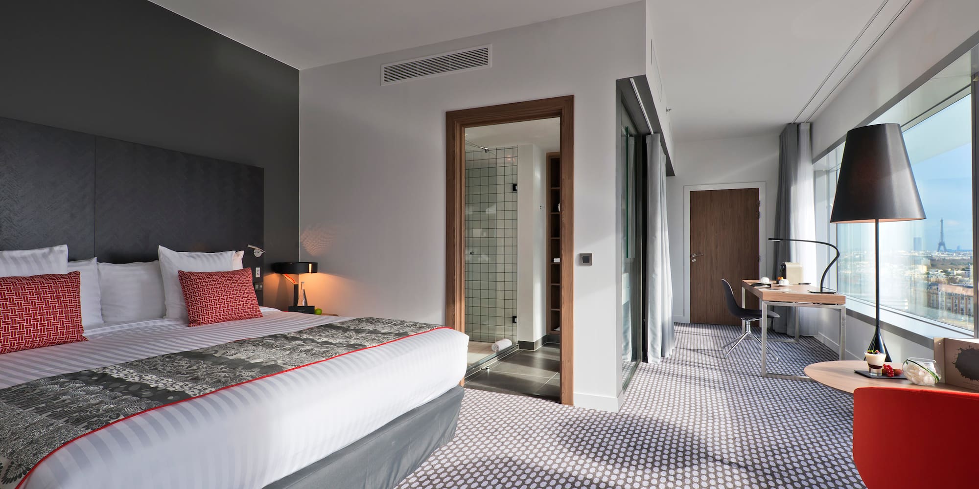 a bedroom with a bed and a desk