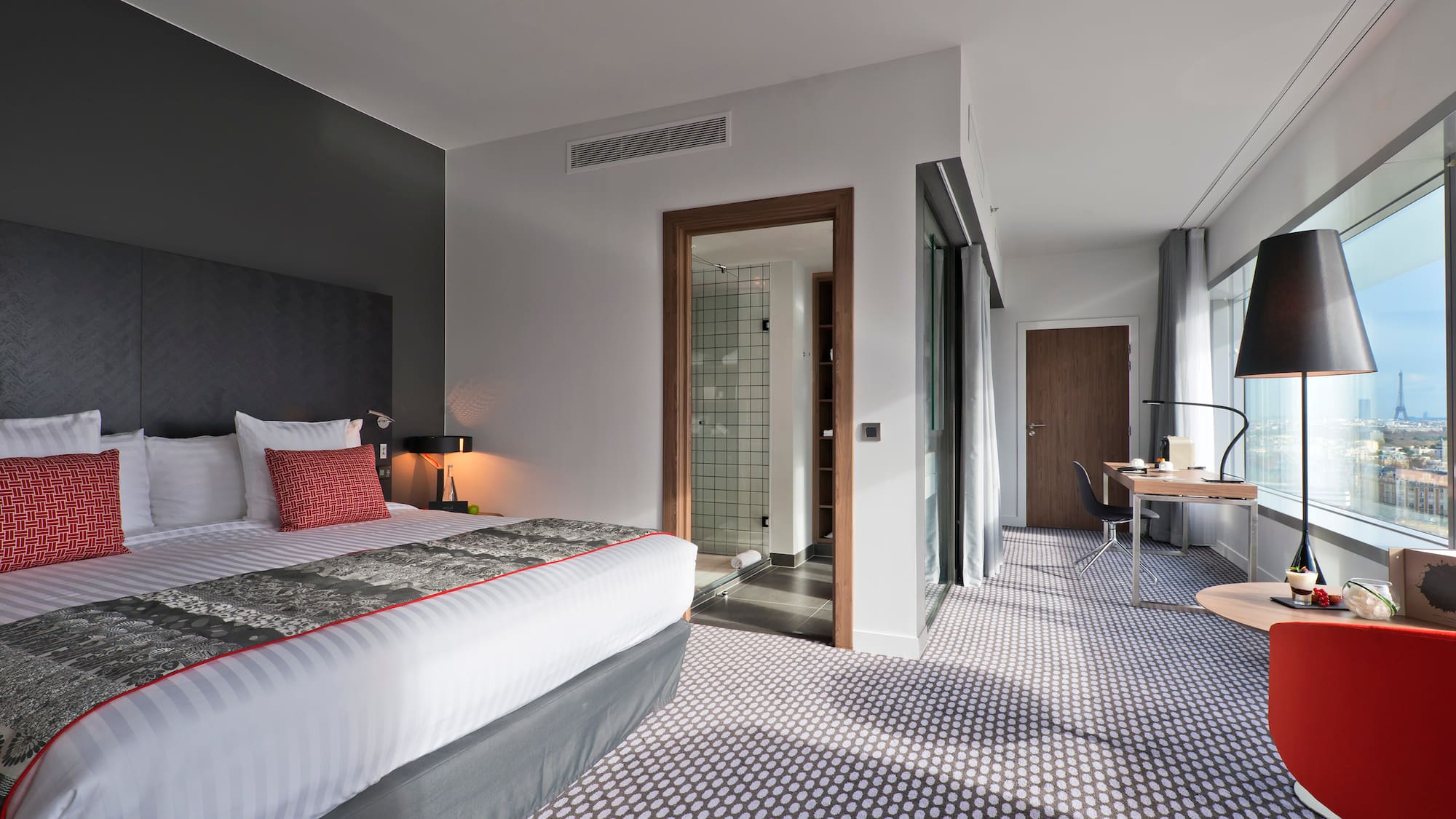 a bedroom with a bed and a desk