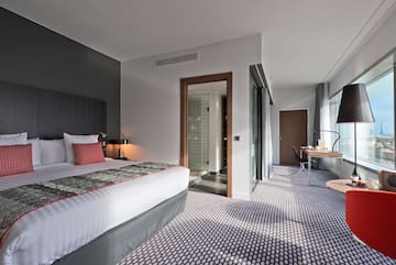 a bedroom with a bed and a desk