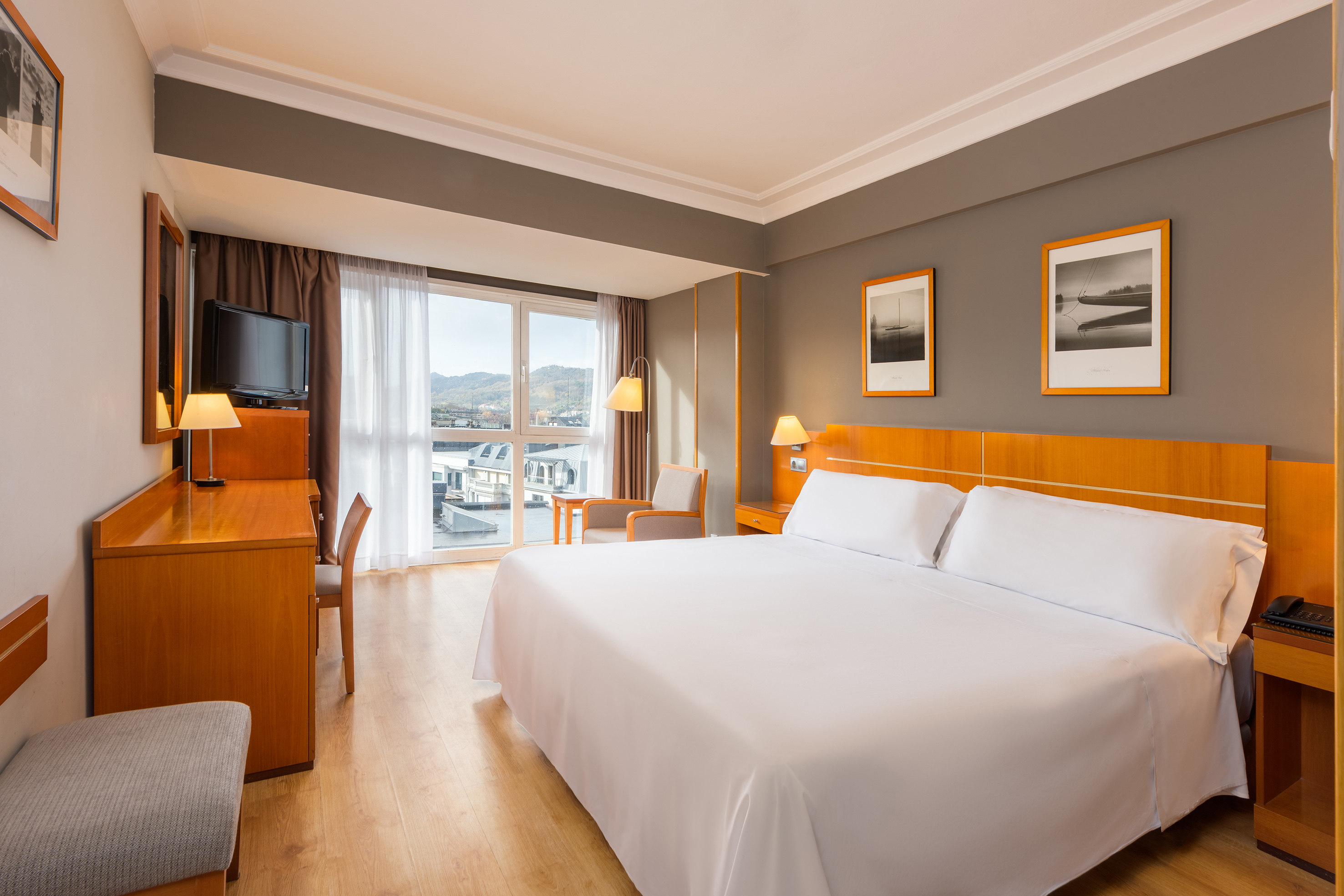 a room with a bed and a desk