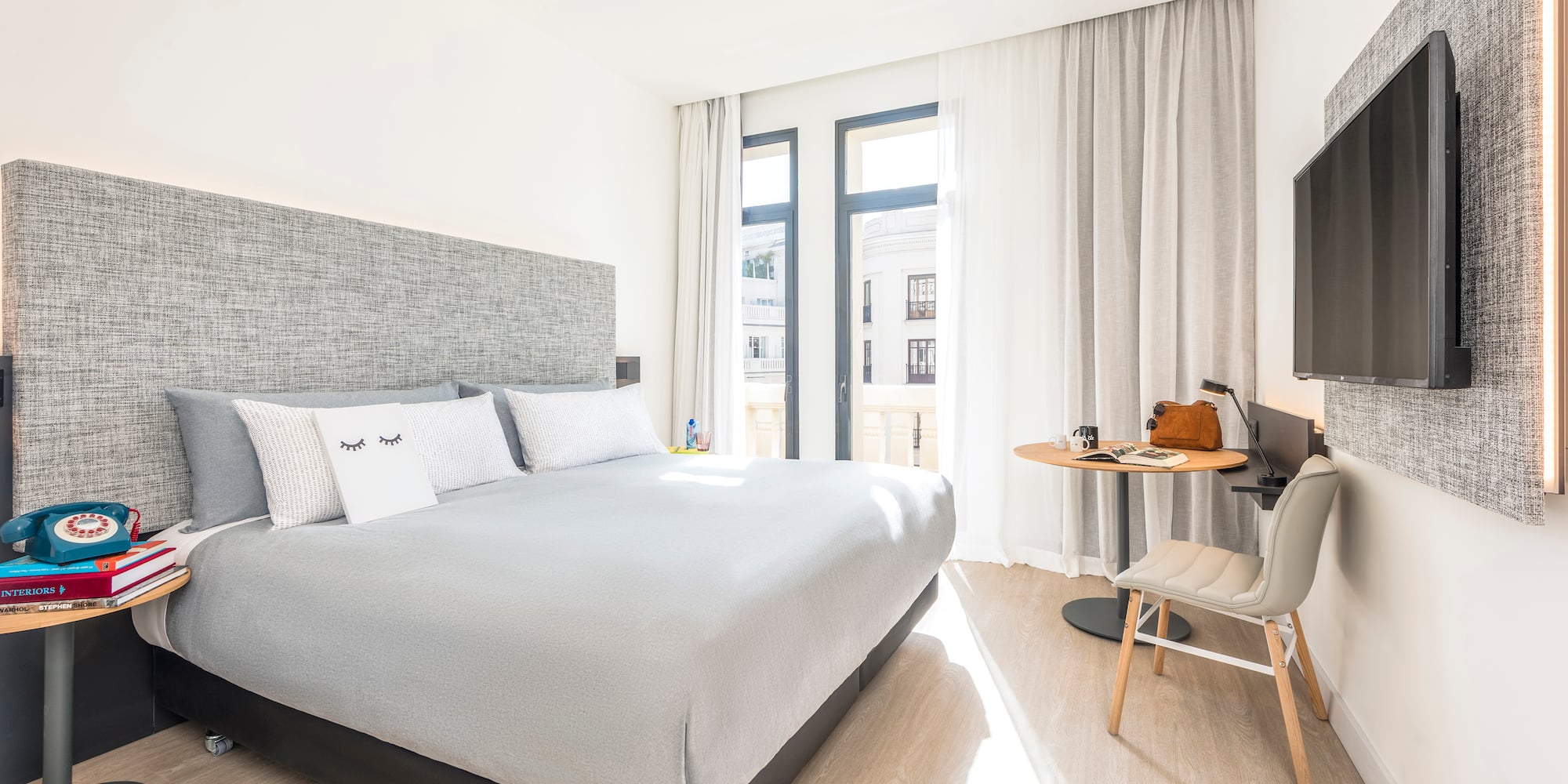 a bedroom with a bed and a desk