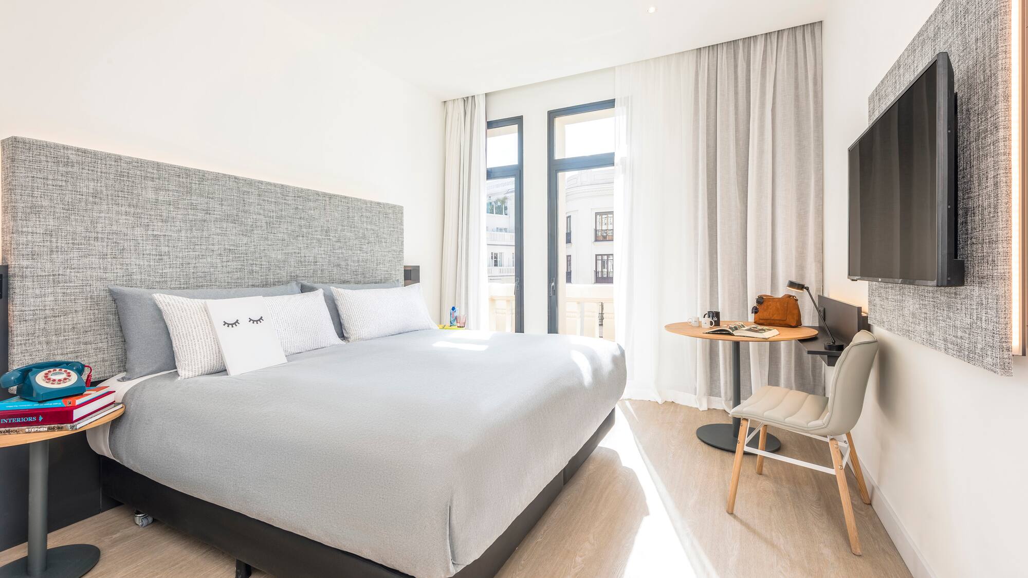 a bedroom with a bed and a desk