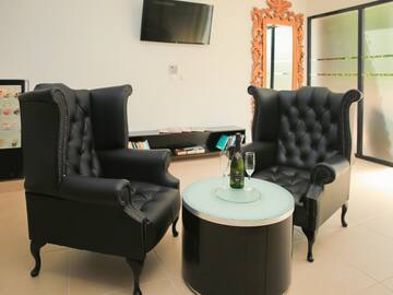 two chairs and a table in a room