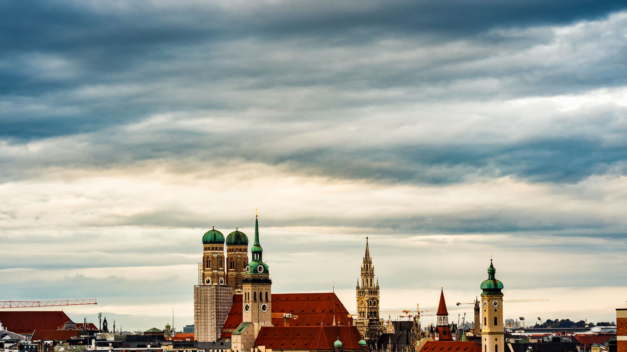 a city with many buildings and a cloudy sky