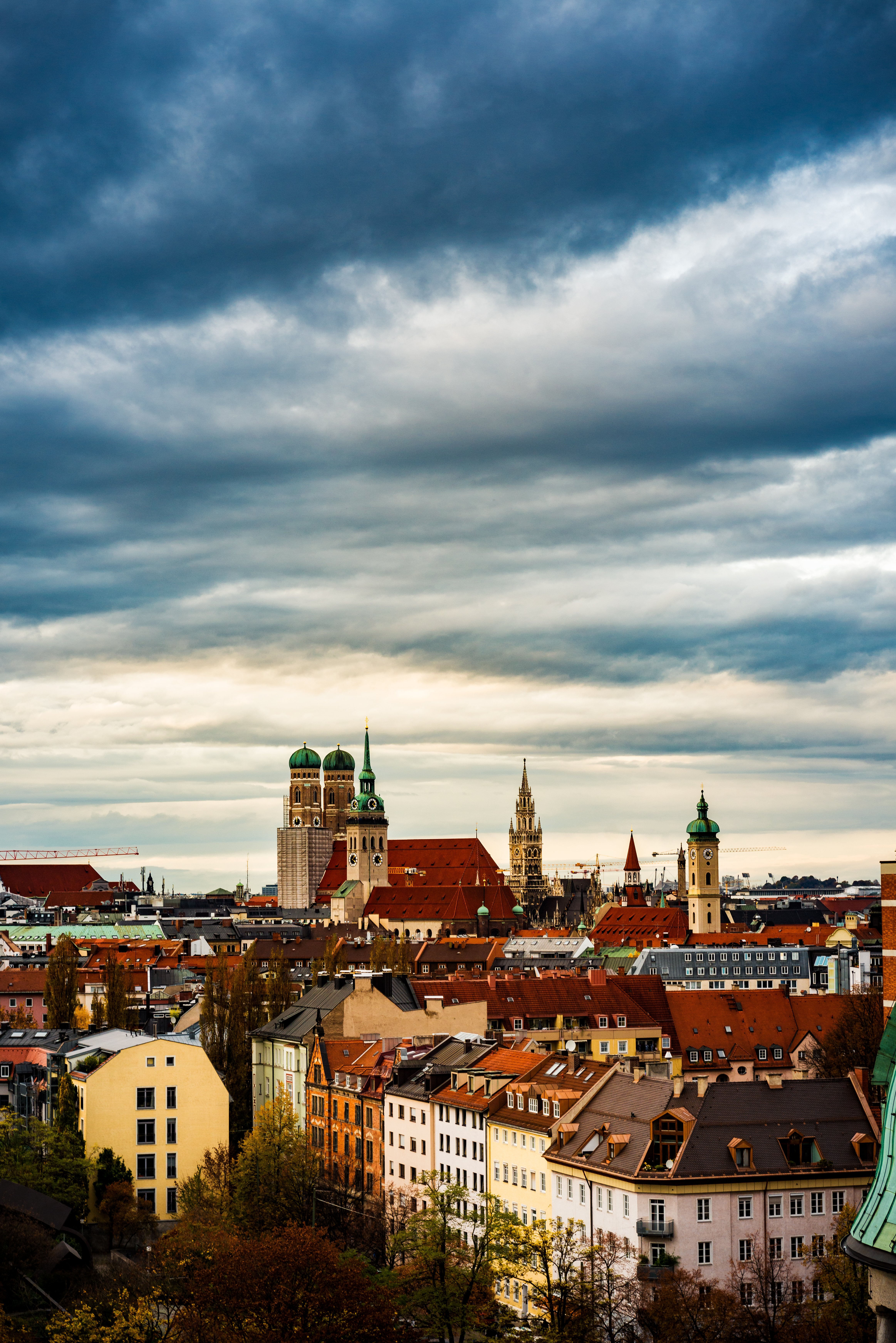 a city with many buildings and a cloudy sky