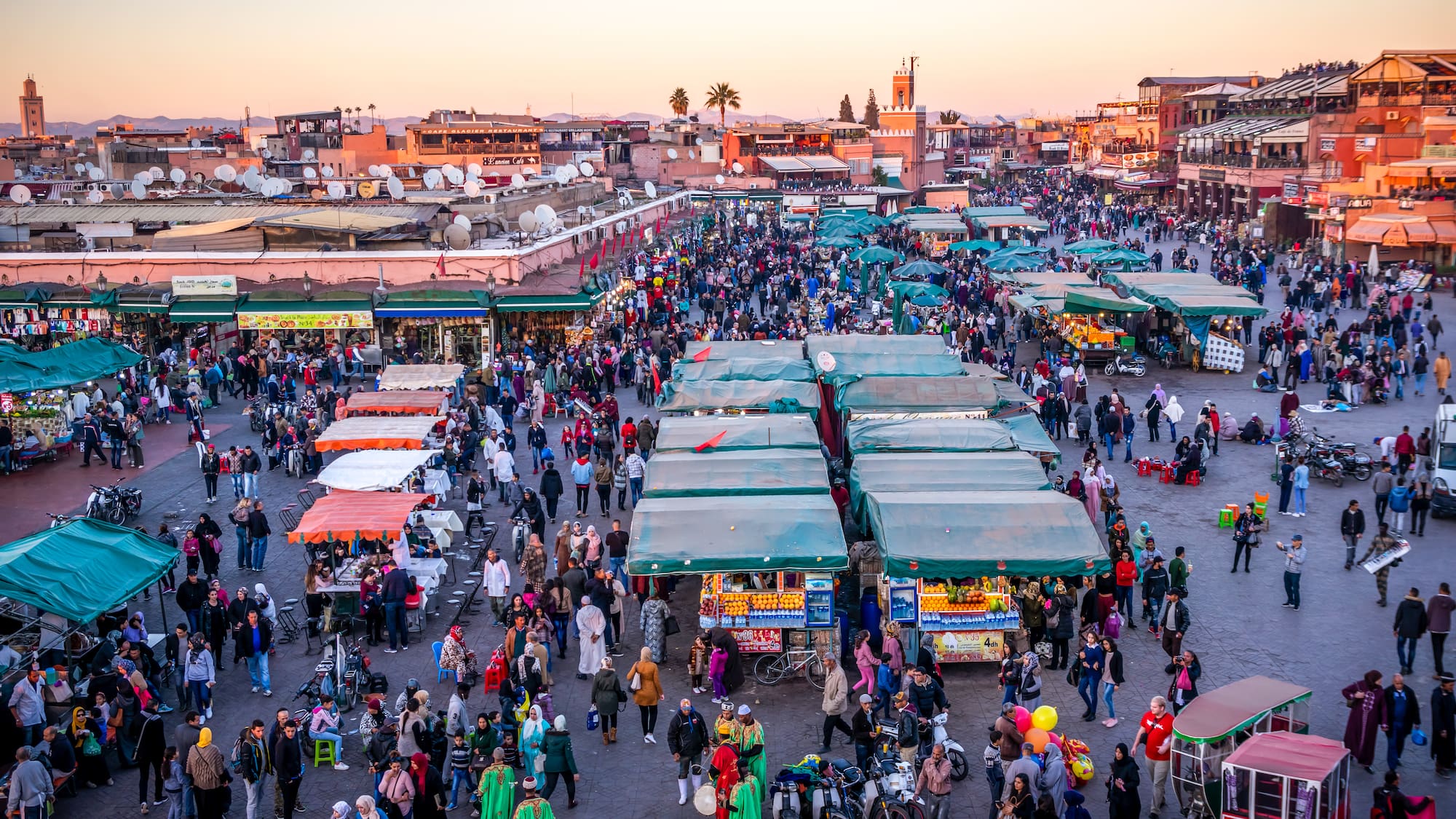 a crowd of people in a street market