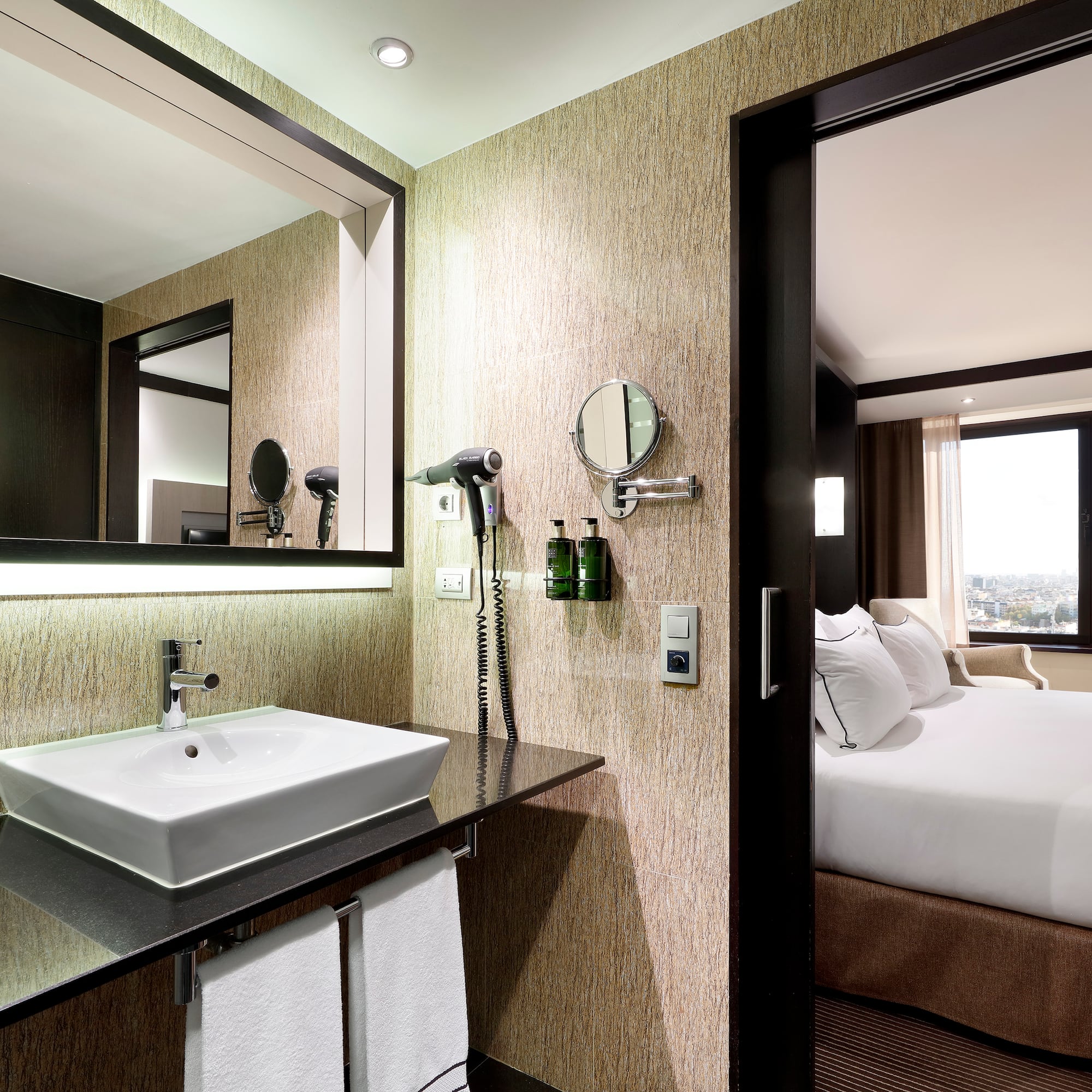 a bathroom with a mirror and a sink