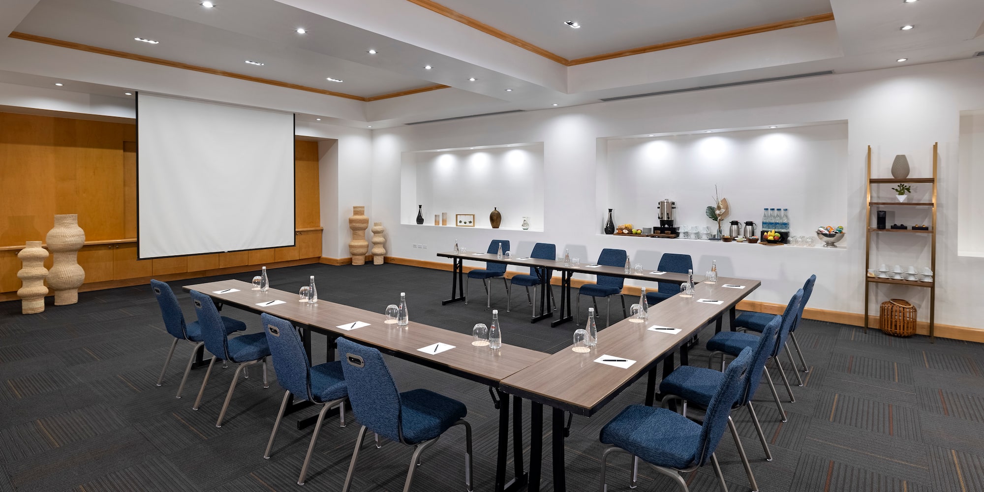 a room with a large table and chairs