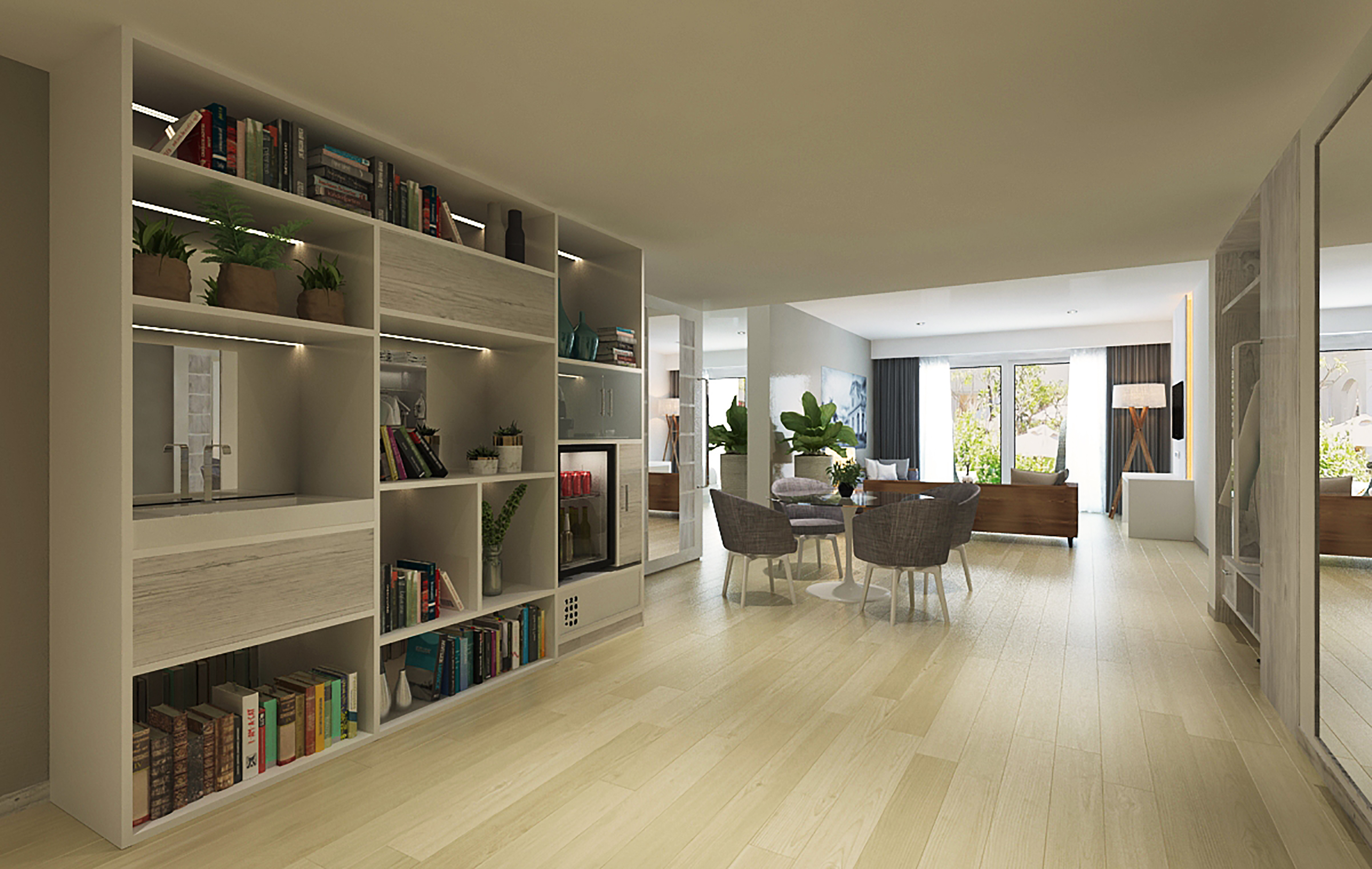a room with a dining table and bookshelves