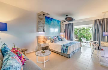 a bedroom with a bed and a couch