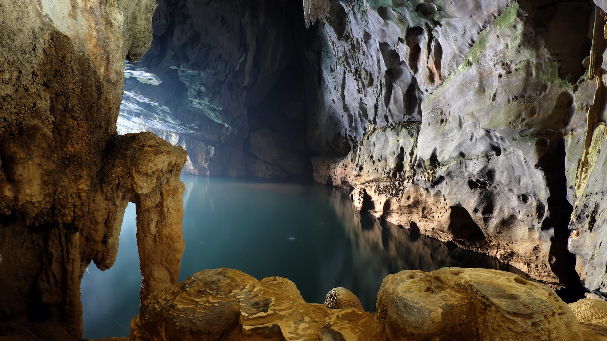 a cave with a body of water