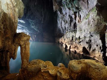 a cave with a body of water