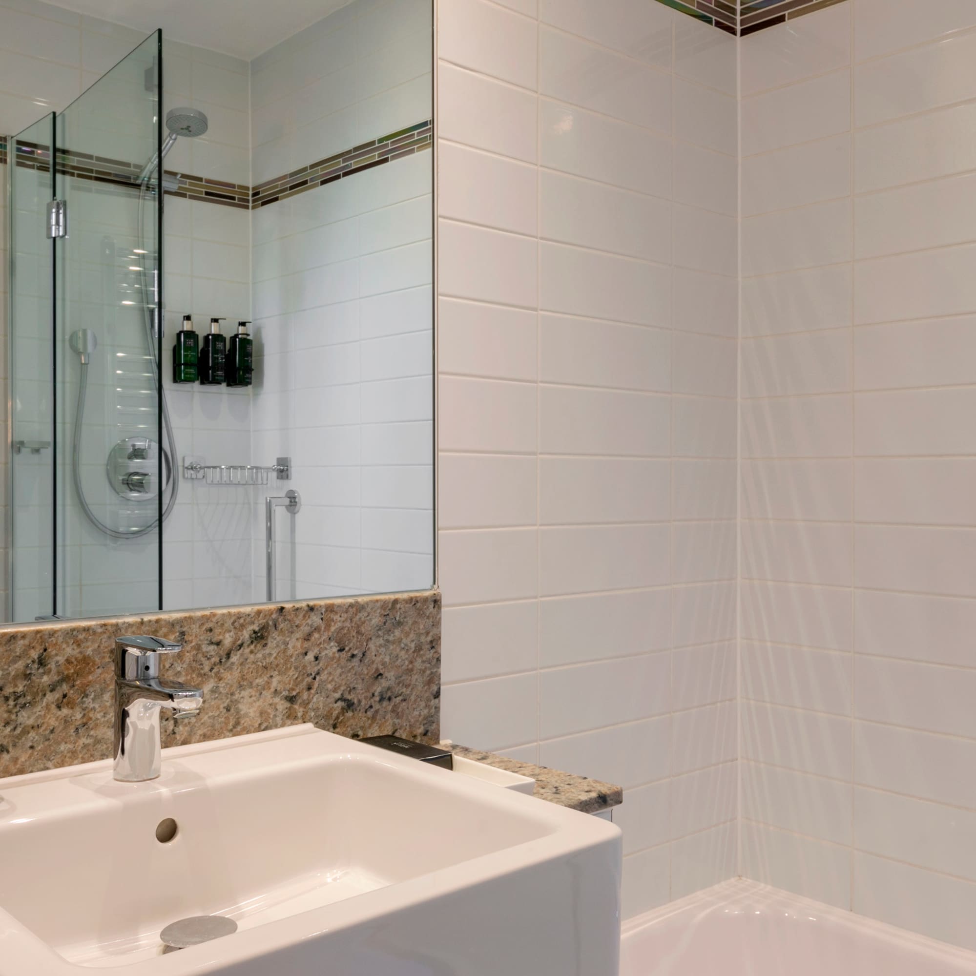 a bathroom with a shower and sink