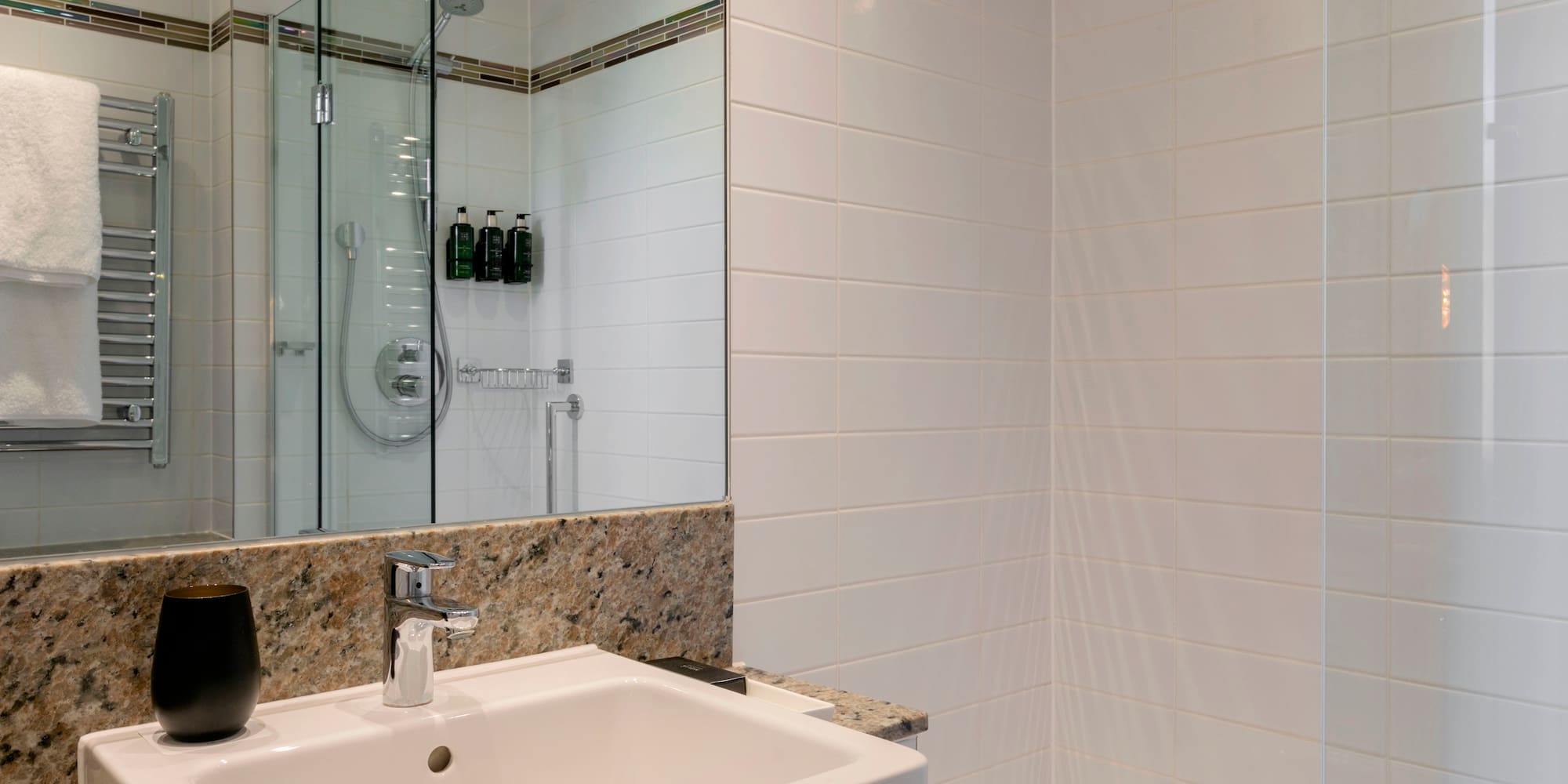 a bathroom with a shower and sink