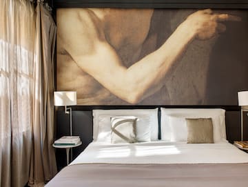 a bed with a picture of a muscular man