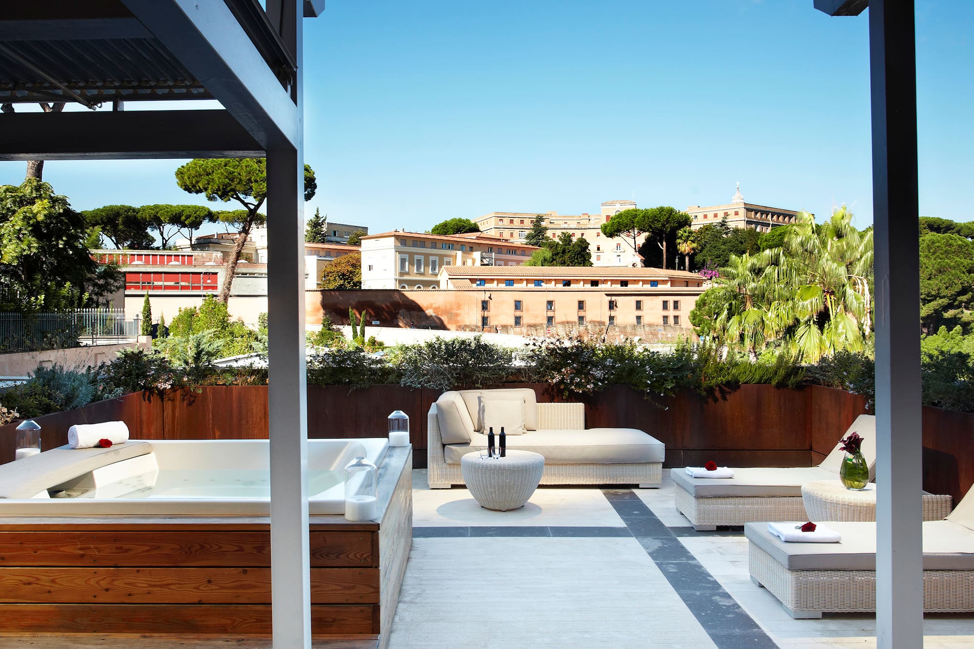a patio with a hot tub and a hot tub