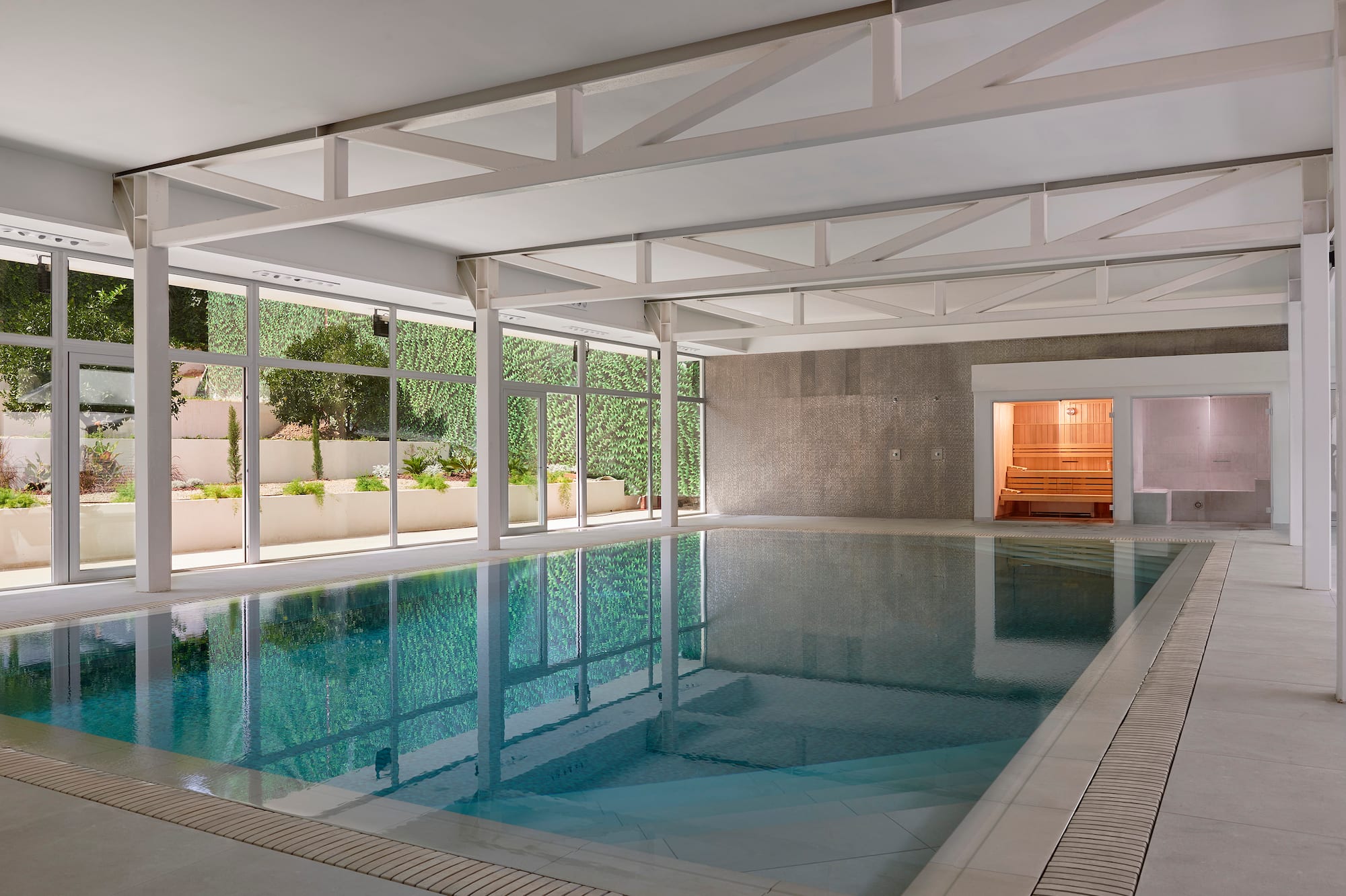 a indoor pool with windows
