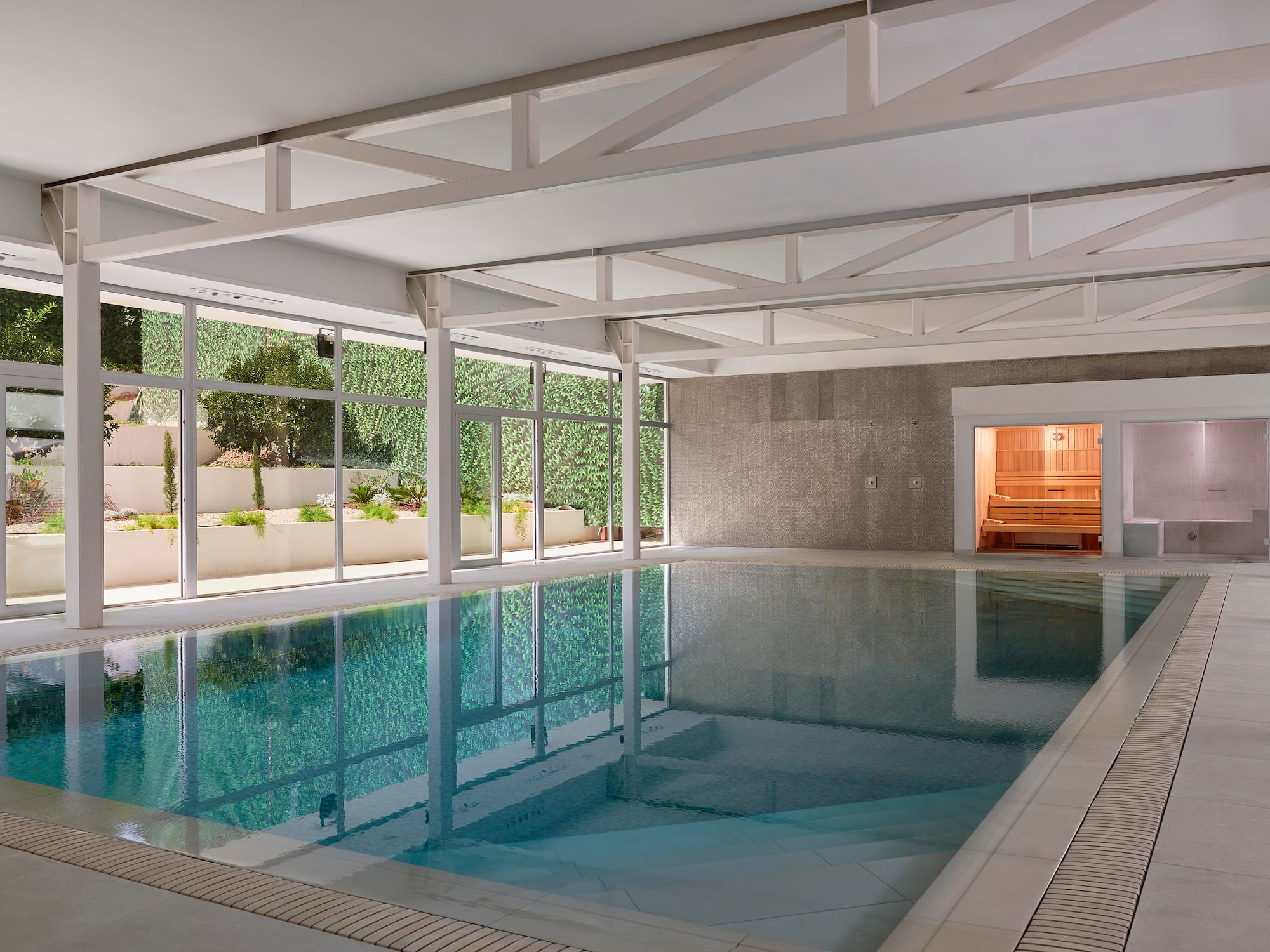 a indoor pool with windows