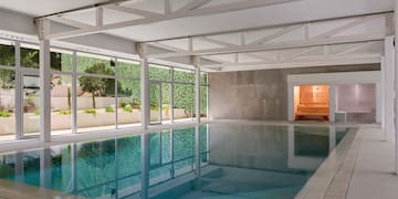 a indoor pool with windows