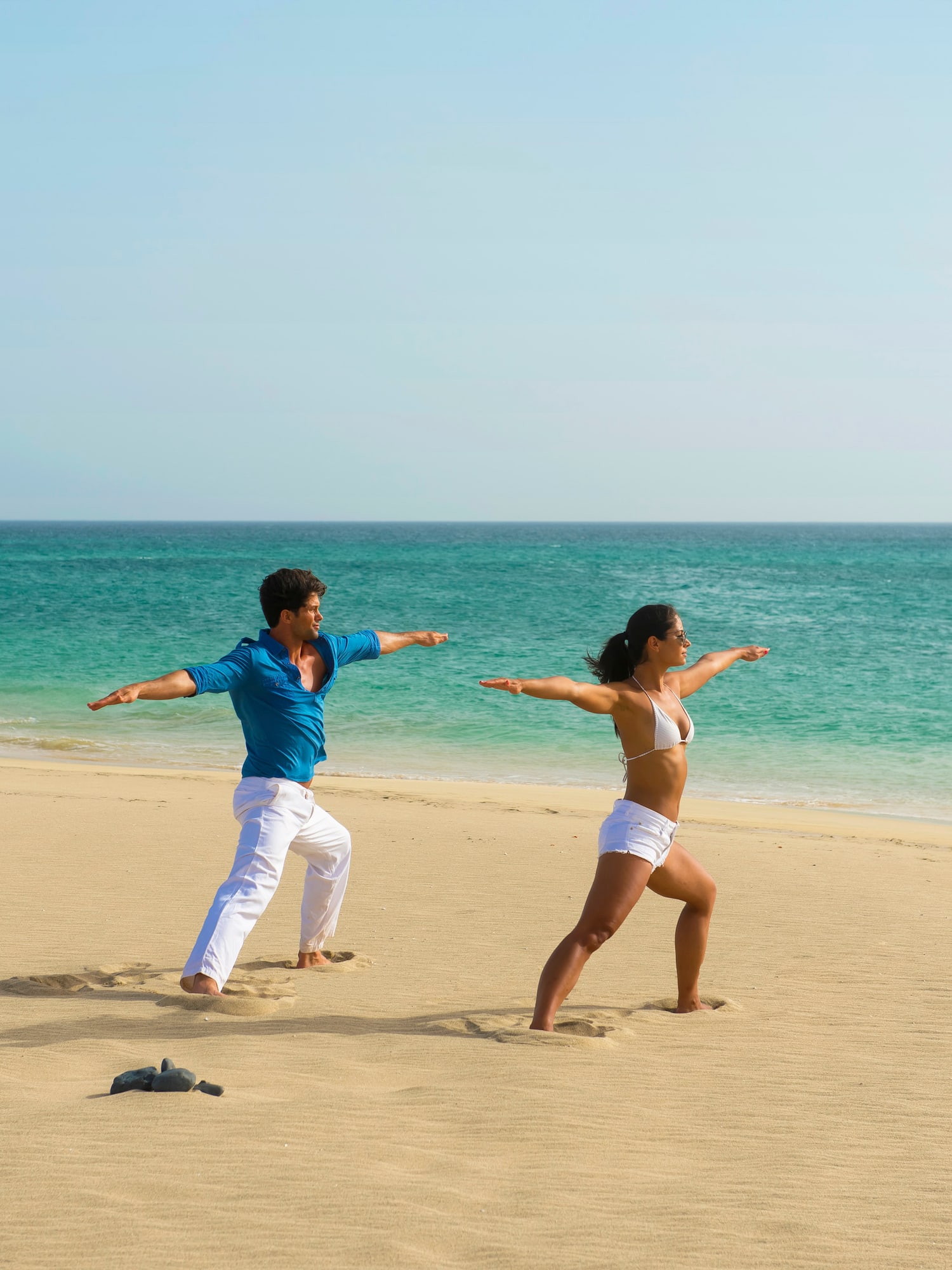 a man and woman on a beach