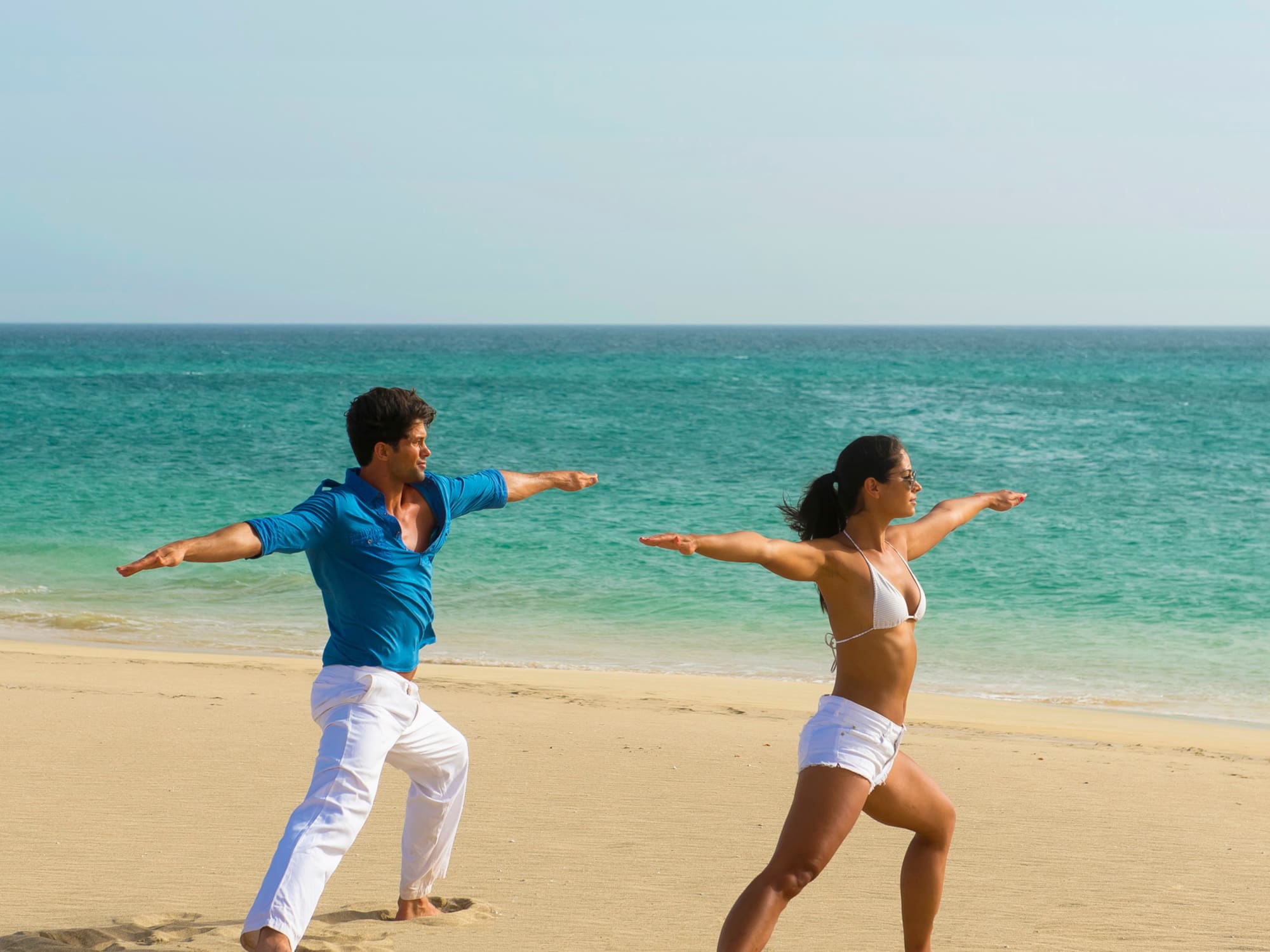 a man and woman on a beach