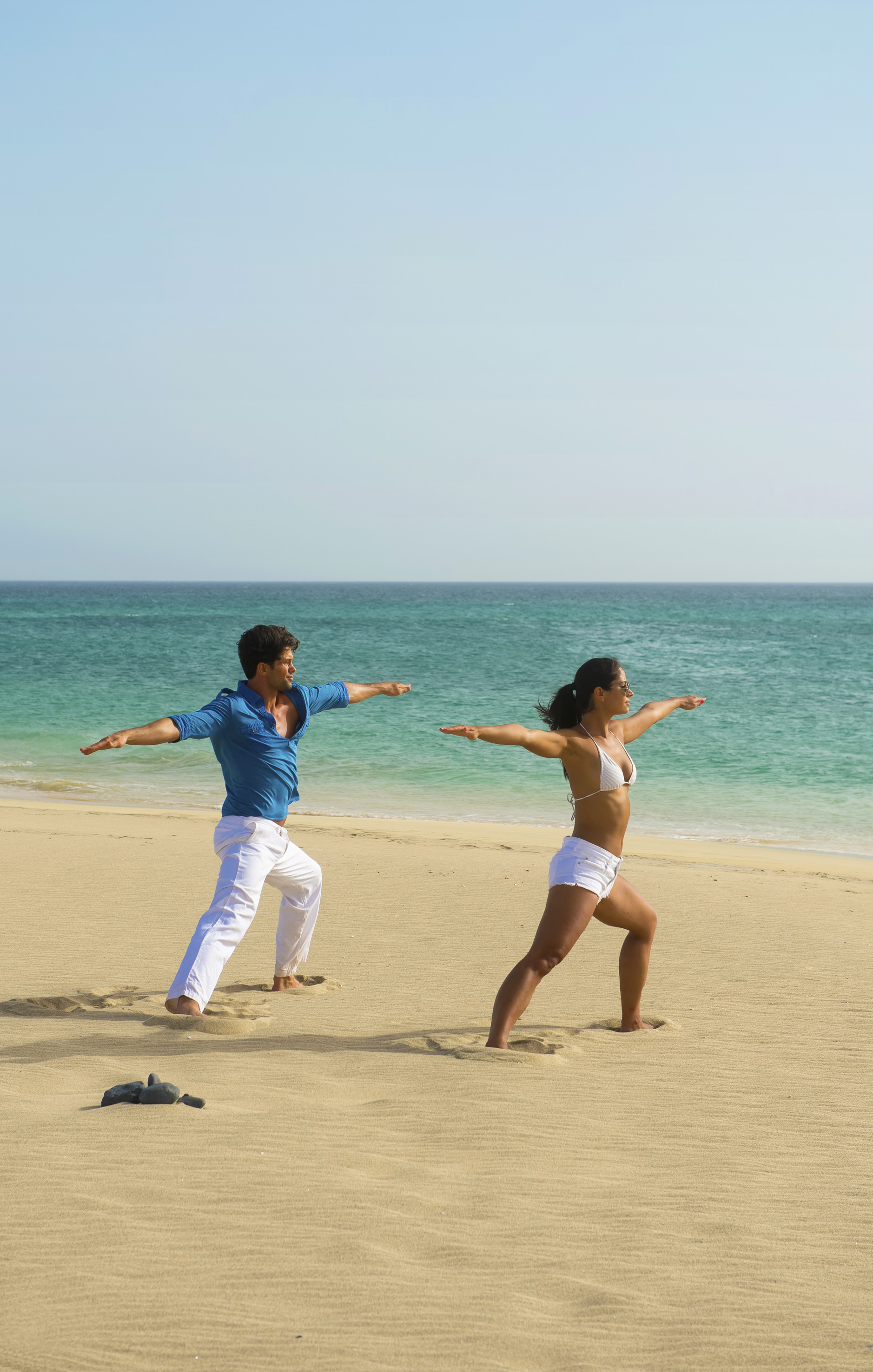 a man and woman on a beach