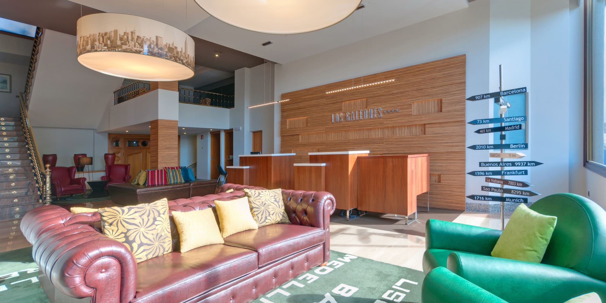 a room with a couch and chairs