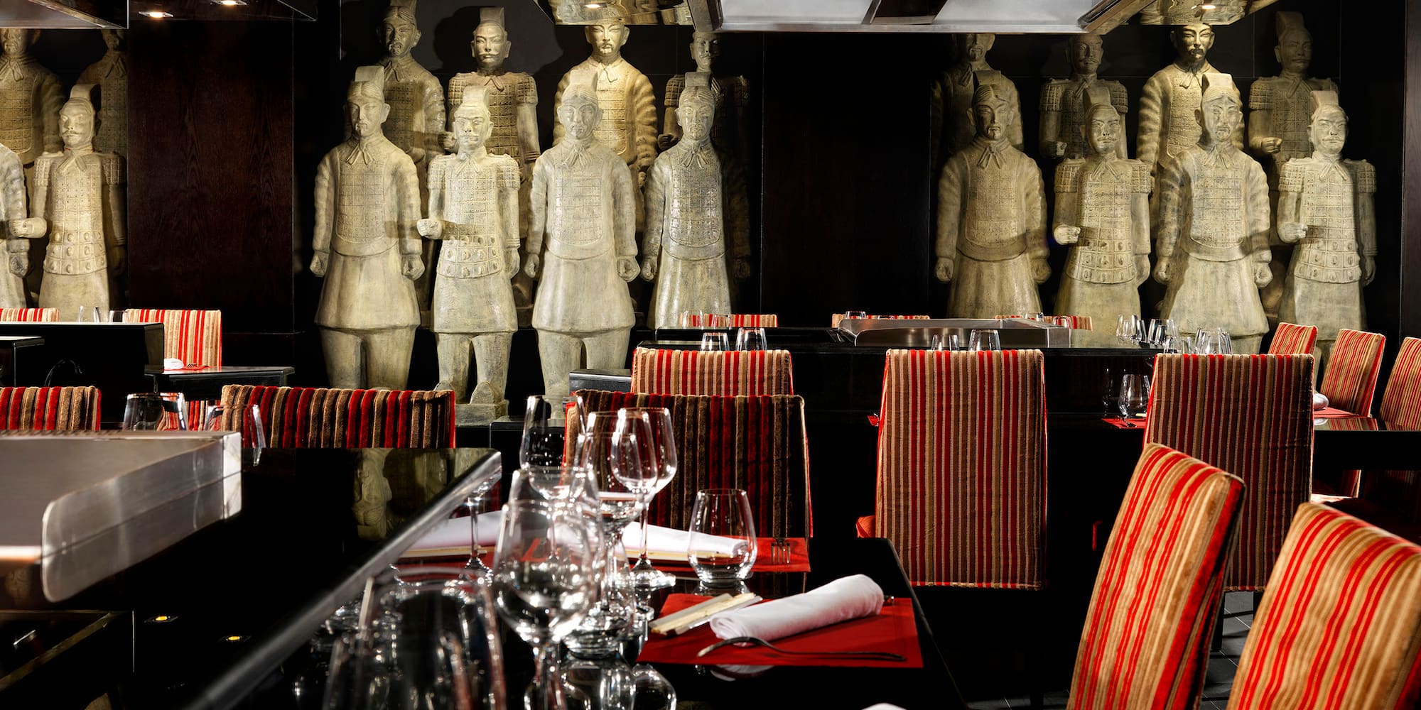 a restaurant with statues of men