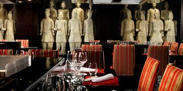 a restaurant with statues of men