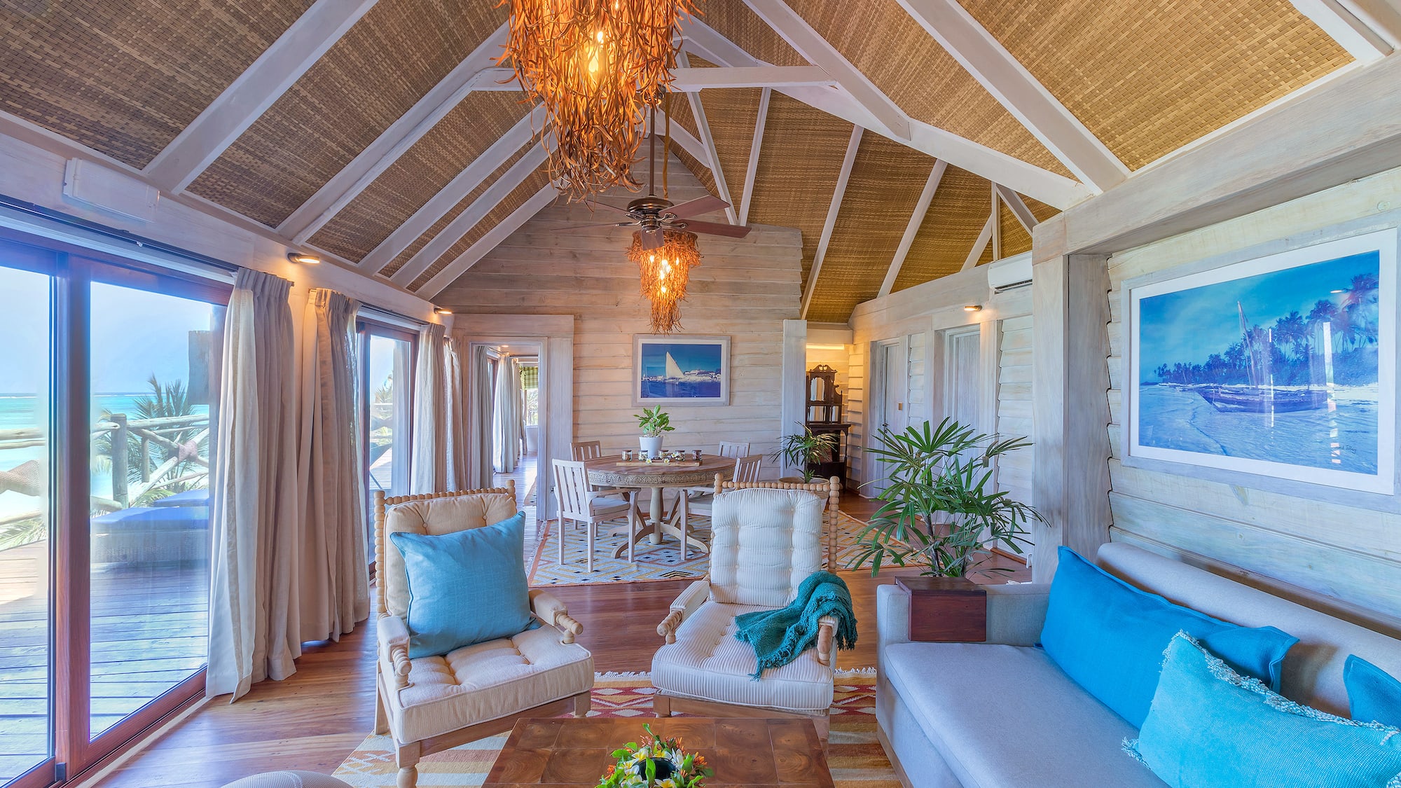 a living room with a table and chairs