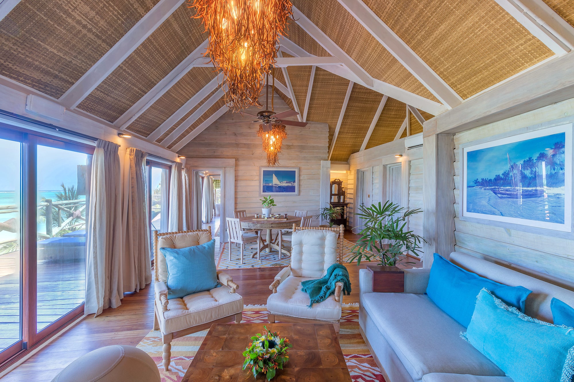a living room with a table and chairs